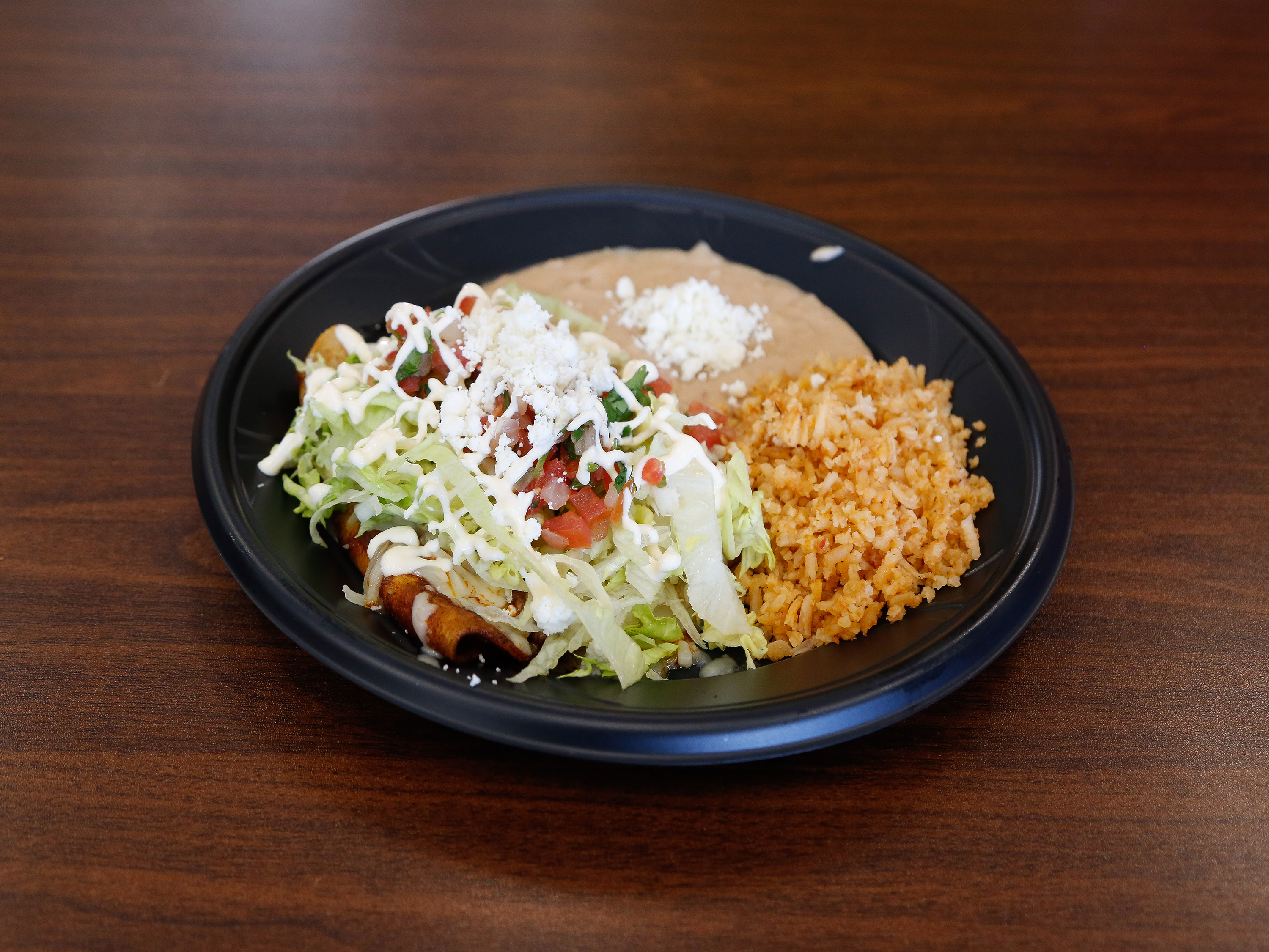 Order 3 Enchiladas with Beans and Rice food online from Hacienda Market & Grill store, Carson City on bringmethat.com