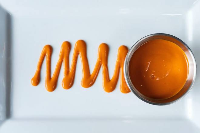 Order Side Buffalo Sauce food online from Bar Louie store, Granger on bringmethat.com