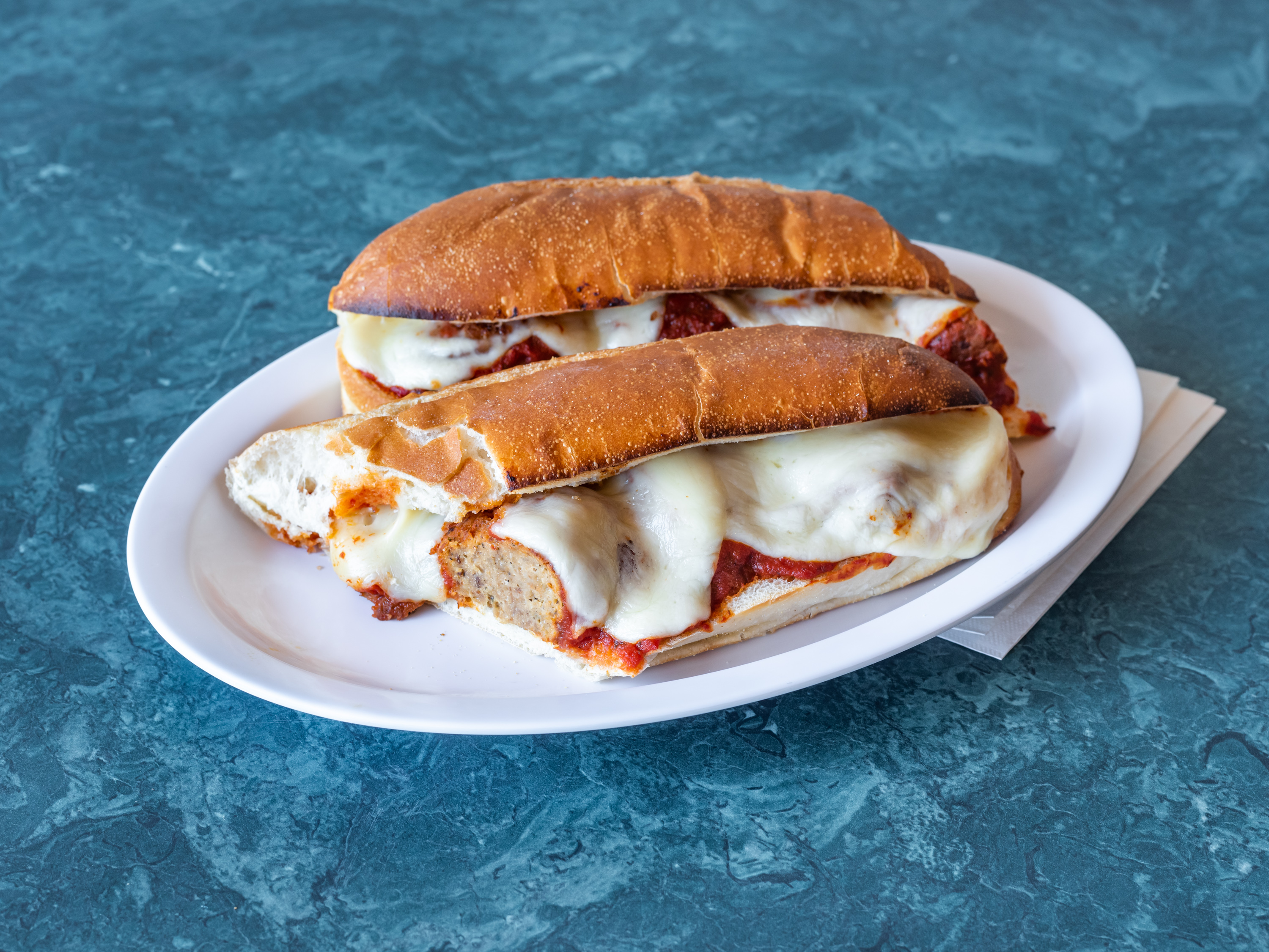 Order 15. Meatball Parmigiana Sub food online from Guidos Pizza store, Eatontown on bringmethat.com
