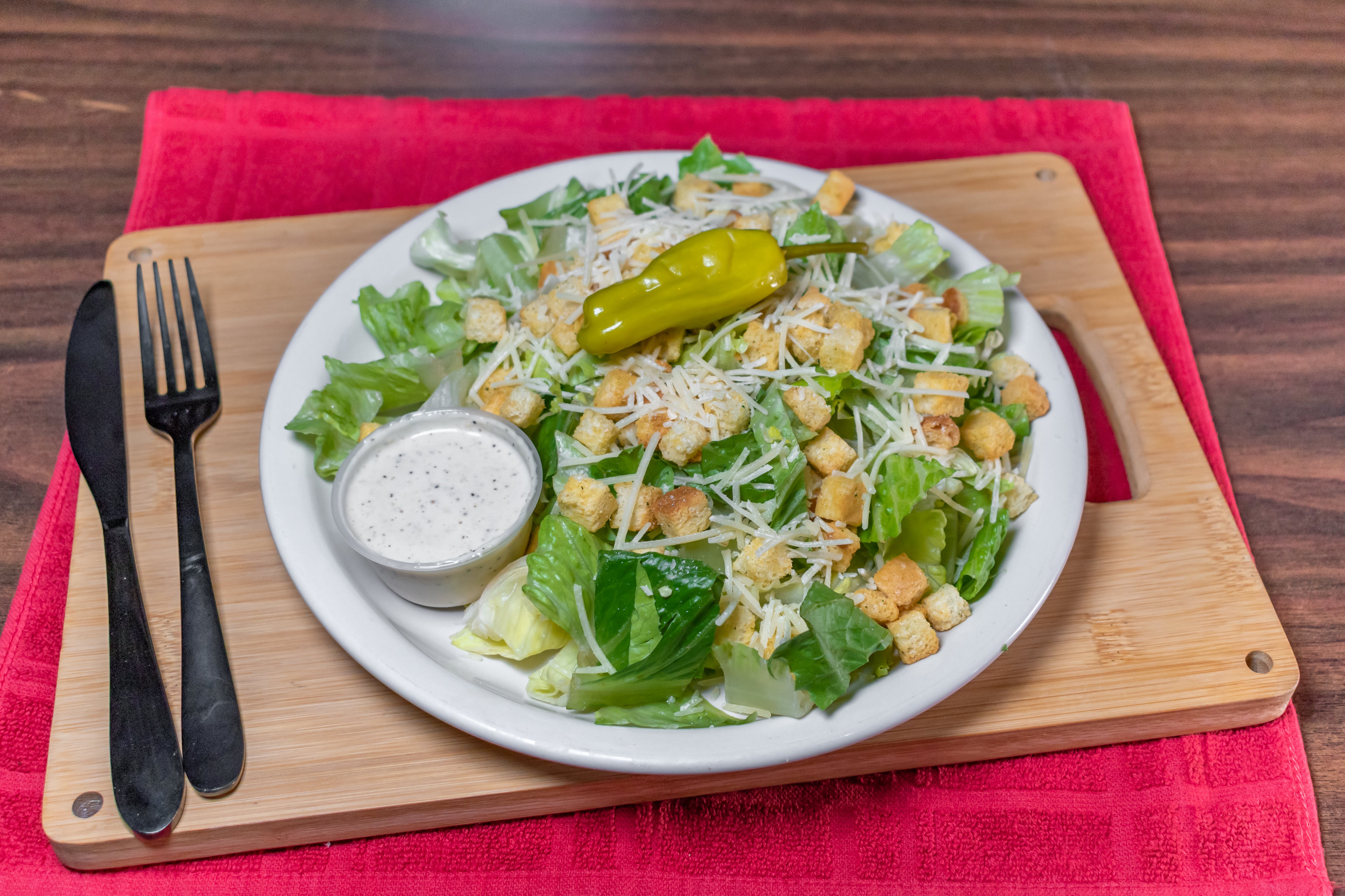 Order Caesar Salad - Medium food online from Gotham Pizza store, Houston on bringmethat.com