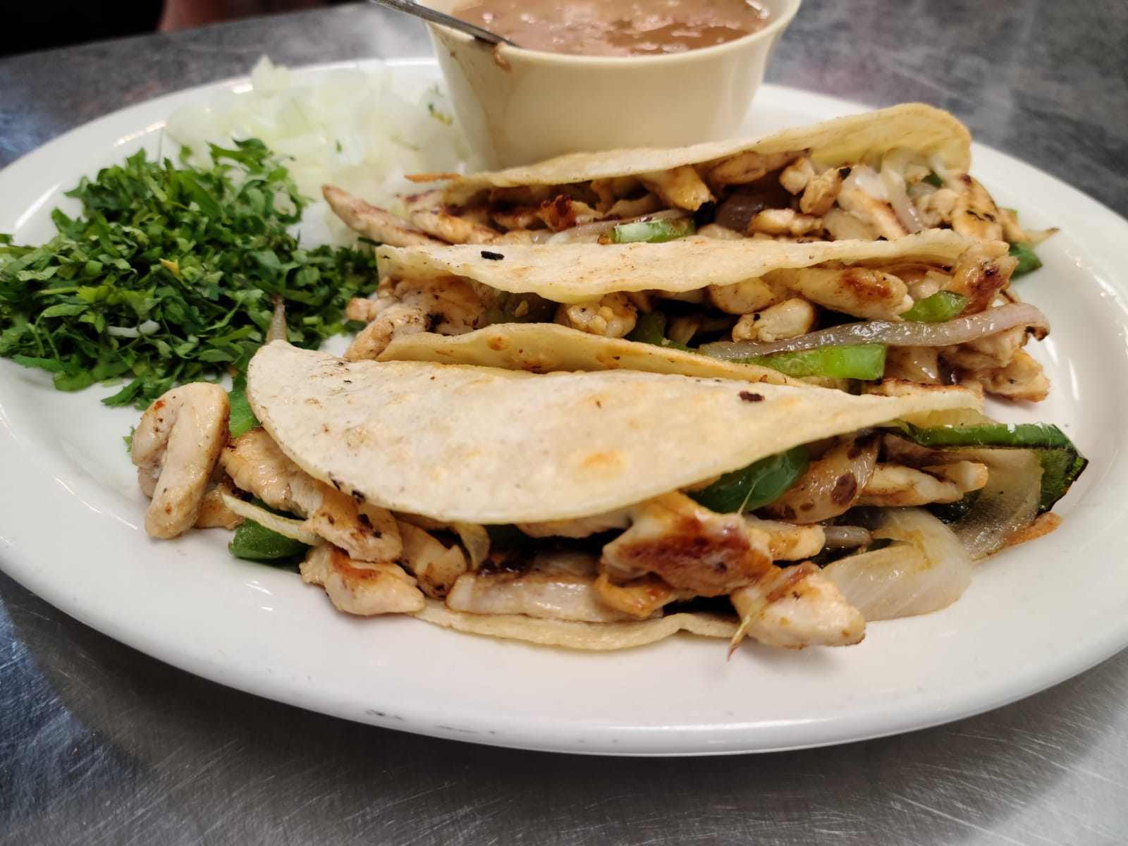 Order Chicken Fajita Taco food online from Los Arcos Mexican Grill store, San Antonio on bringmethat.com