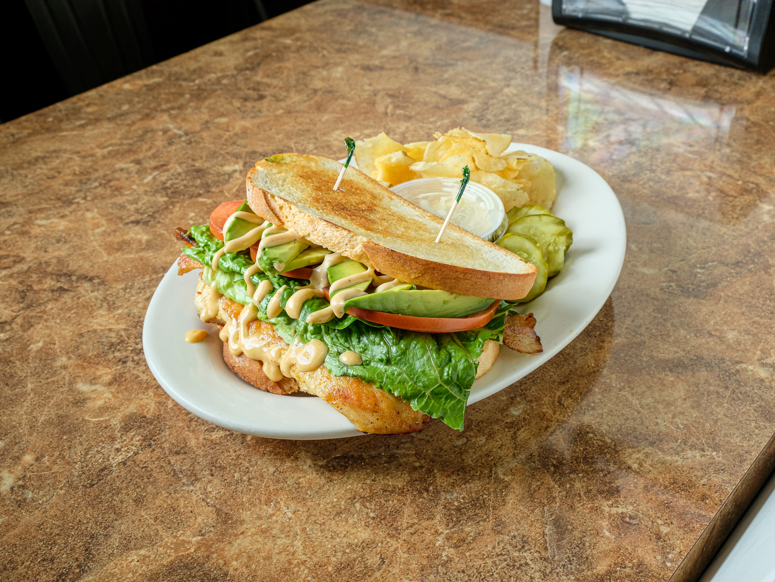 Order The Avocado Club Sandwich food online from Westmont Bagels - Deli & Cafe store, Haddon Township on bringmethat.com