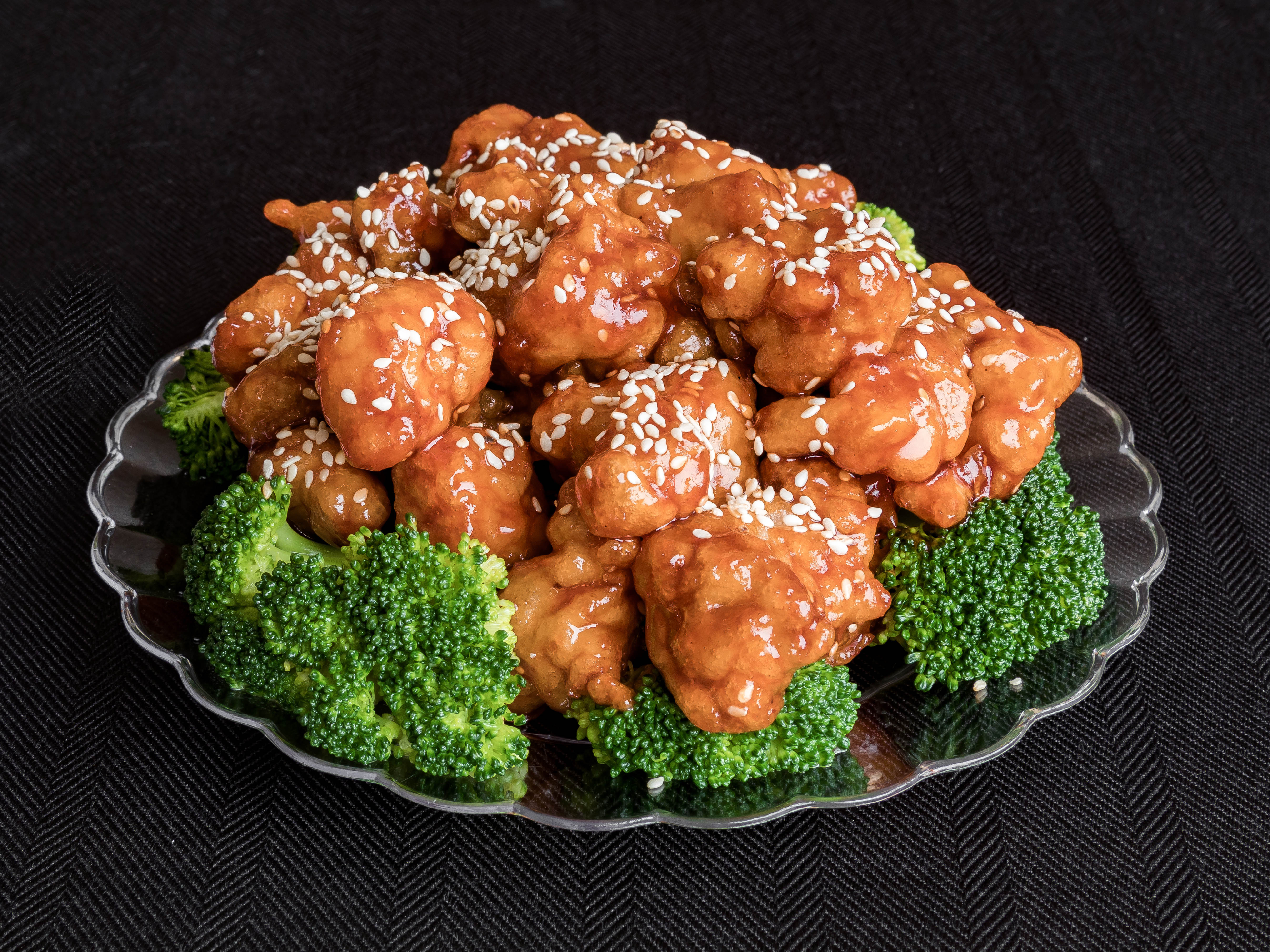 Order 96. Sesame Chicken food online from New China Chinese Restaurant store, Philadelphia on bringmethat.com
