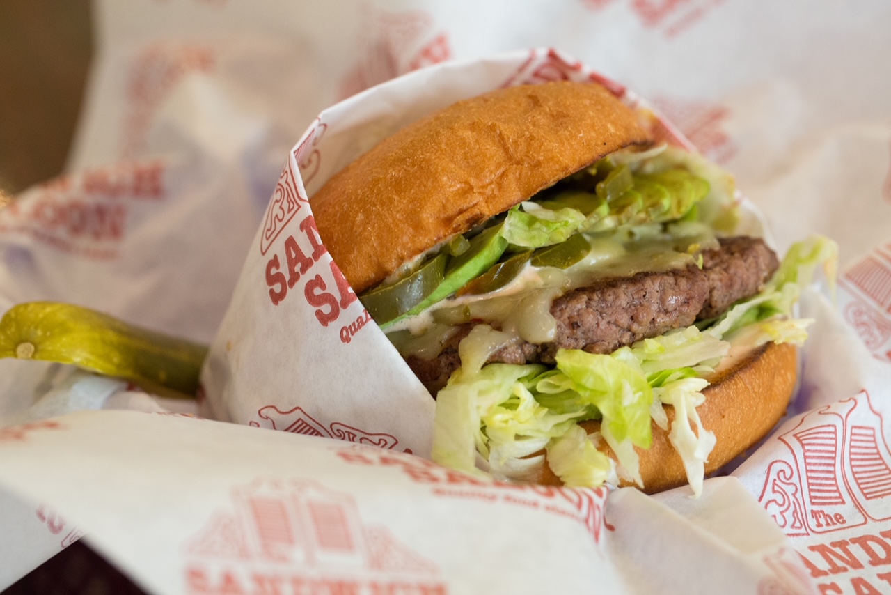Order Across the Border Burger Lunch food online from Sandwich Saloon store, San Pedro on bringmethat.com
