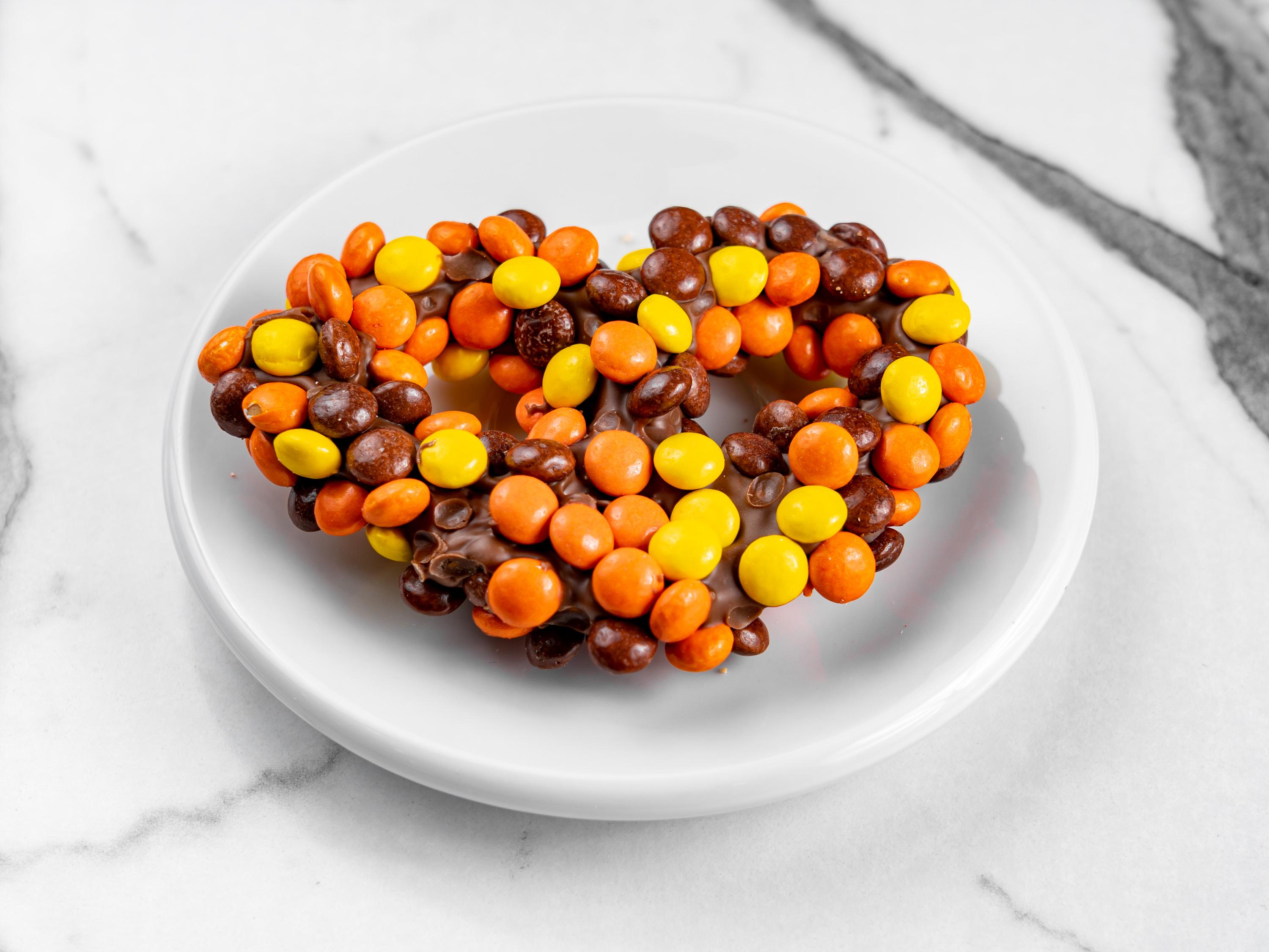 Order Reese's Pieces Pretzel food online from Sweet Spot Cafe store, Seaford on bringmethat.com