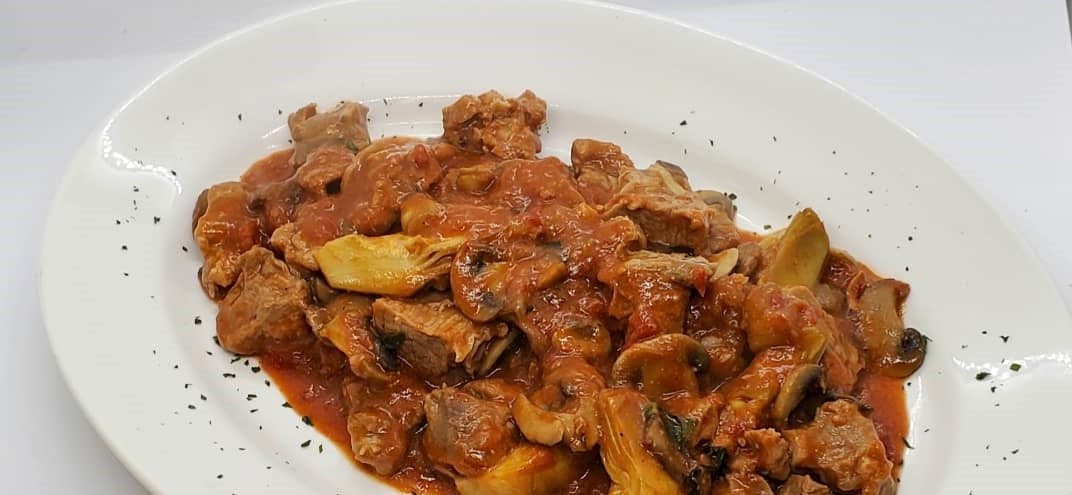 Order Veal Stew Italiano - Entree food online from Bella Italia Ristorante & Pizzeria store, Newton on bringmethat.com