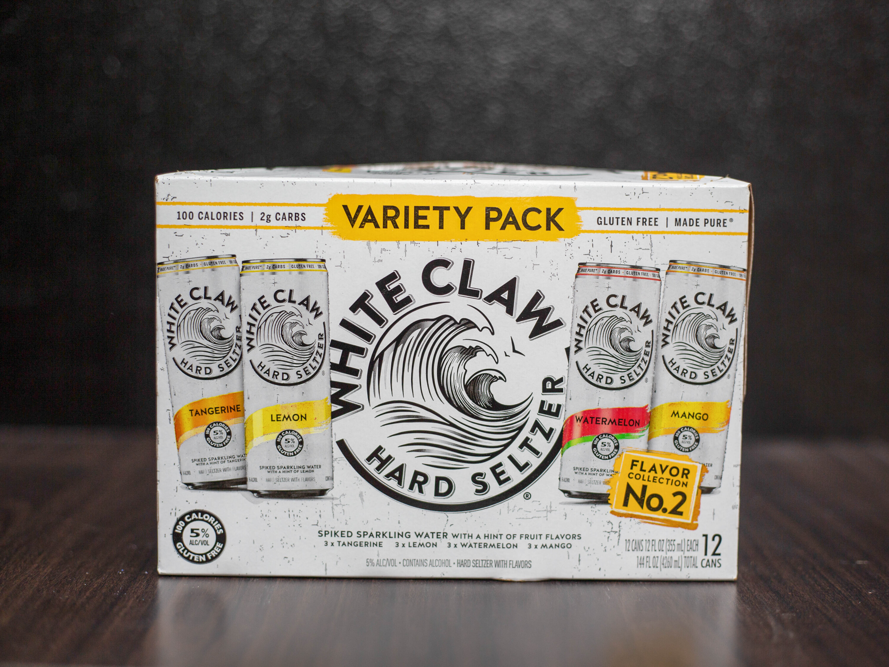 Order White Claw Hard Seltzer Mango 12oz. 12pack Can food online from Stop N Go Liquor store, Oak Forest on bringmethat.com