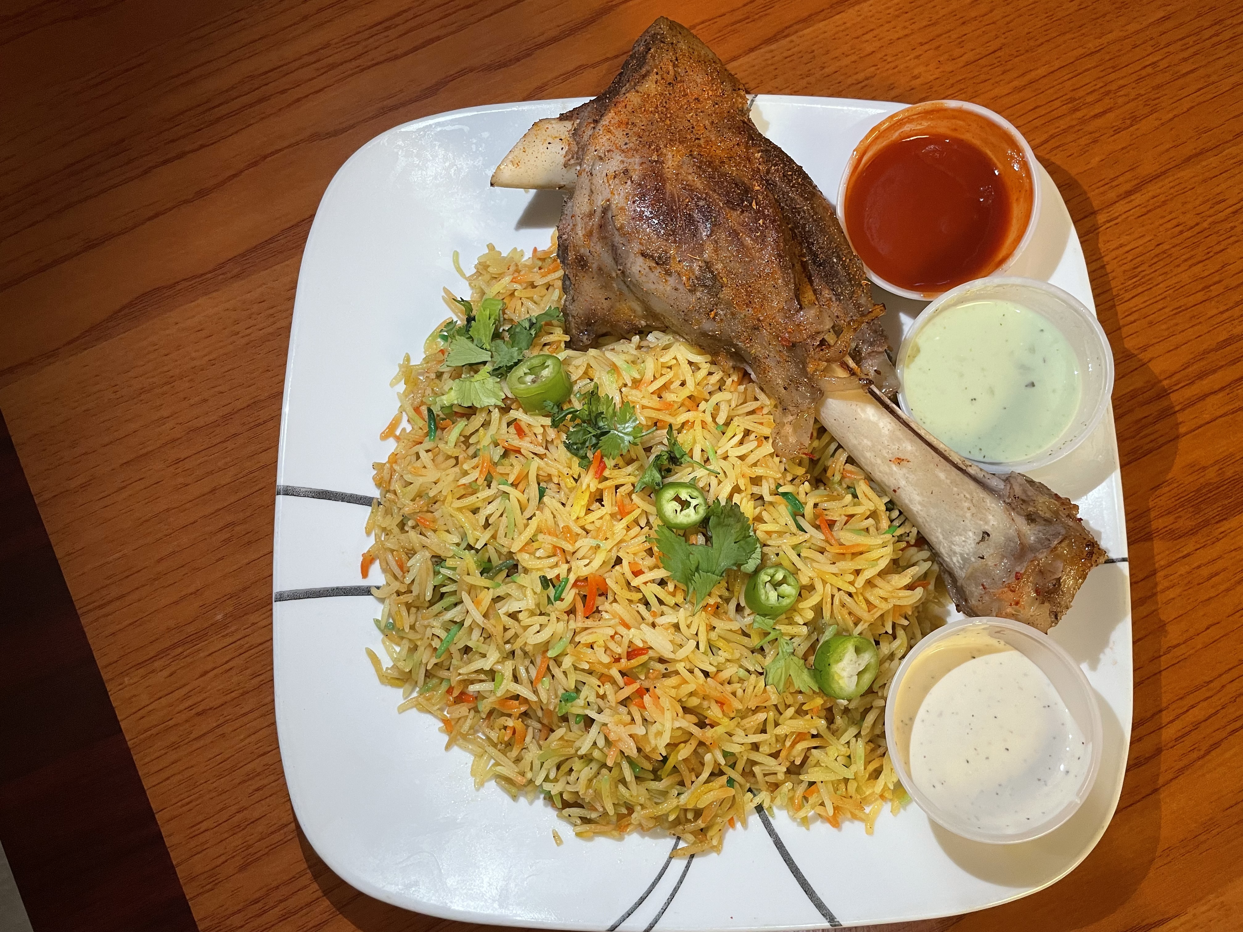 Order 12. lamb shank with bryani food online from Peshawri Kebab store, Waltham on bringmethat.com