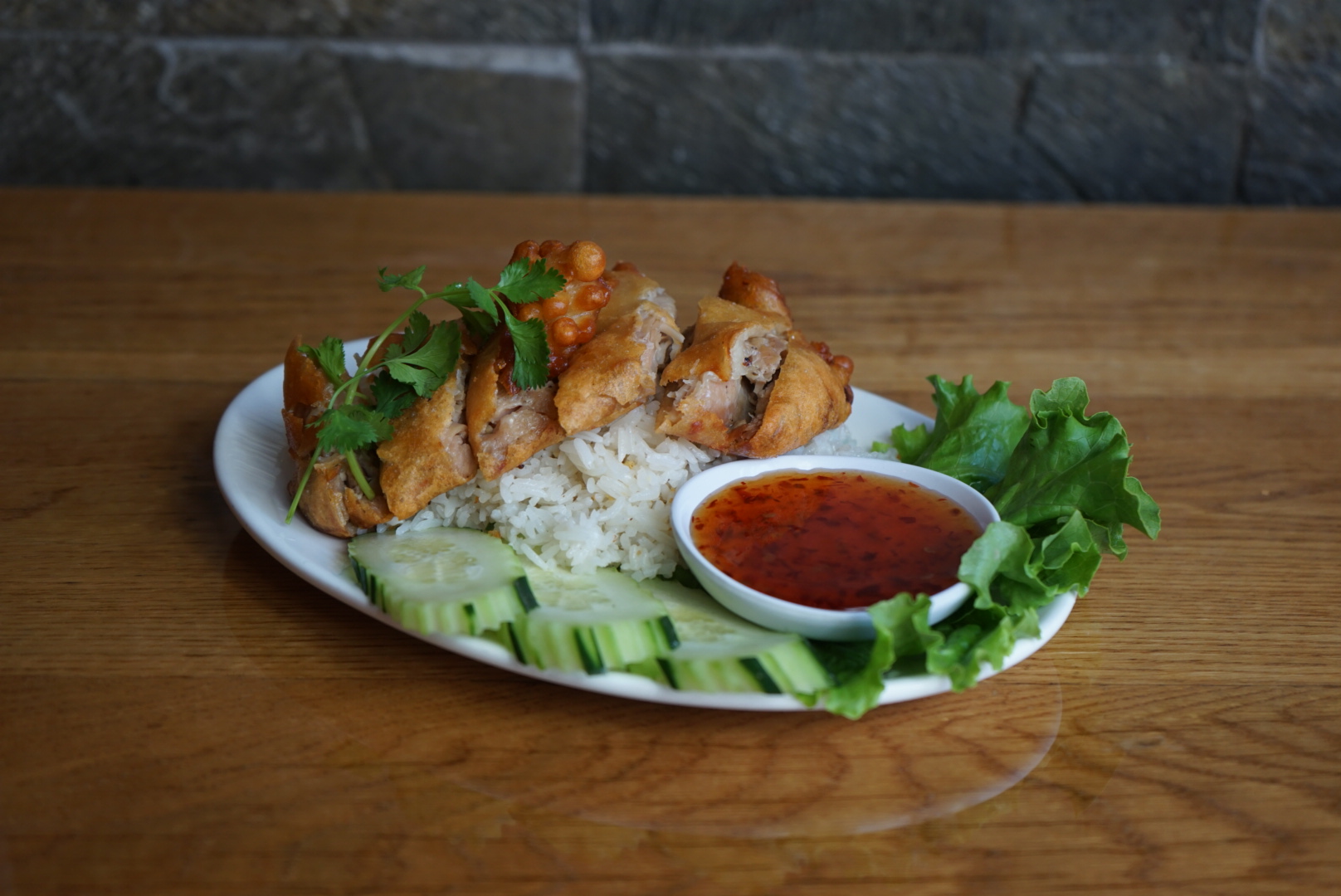Order Garlic Rice with Crispy Chicken  food online from Lers Ros Thai Noodles store, San Francisco on bringmethat.com