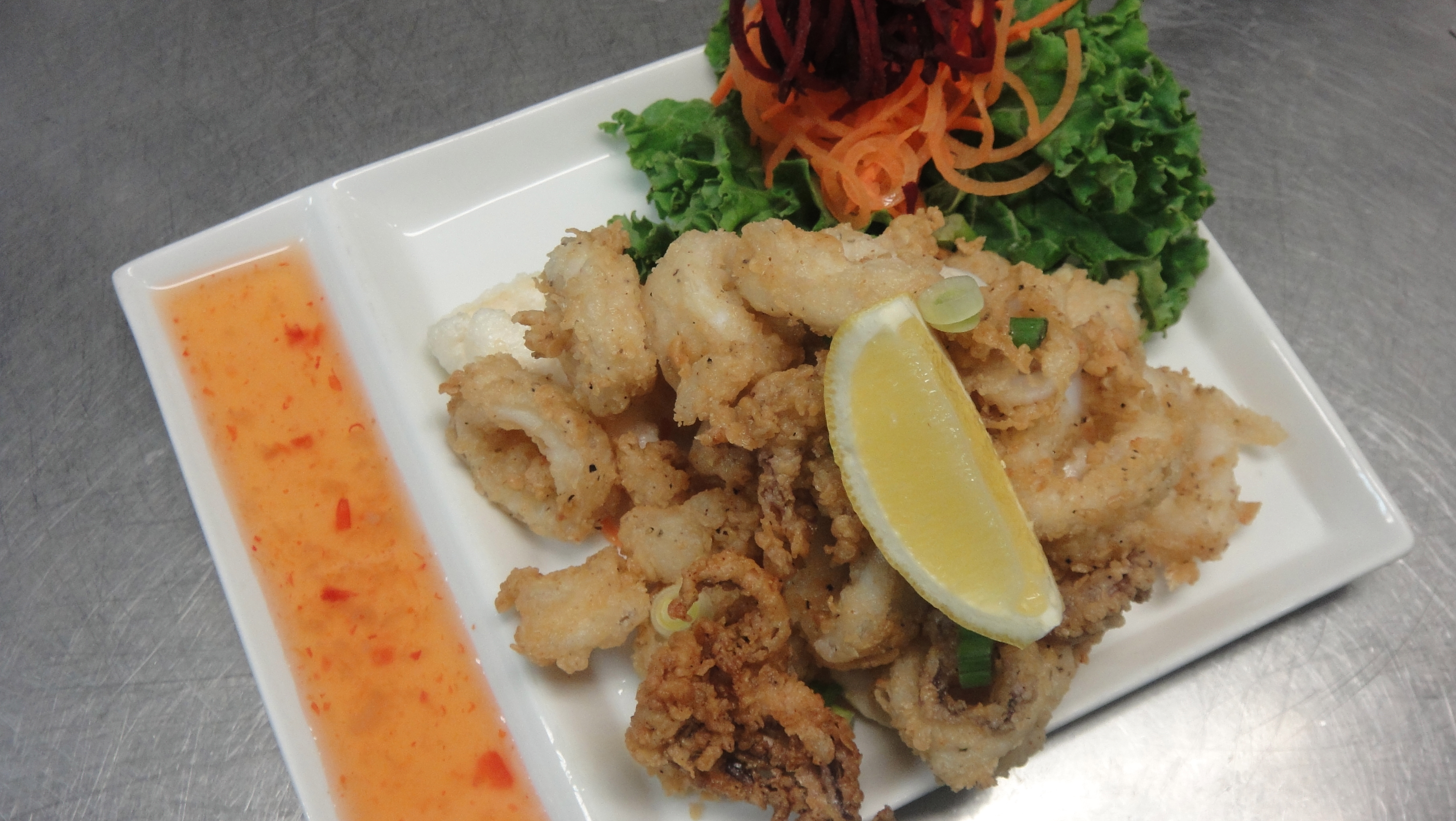 Order A10. Fried Calamari food online from Cha-Ba Thai Cuisine store, Long Beach on bringmethat.com