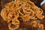 Order Olga's Seasoned Curly Fries Basket food online from Olgas Kitchen store, Lansing on bringmethat.com