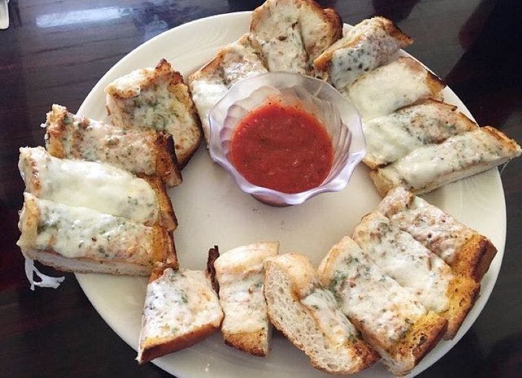 Order Garlic Bread with Cheese - Appetizer food online from Italian Cravings store, San Clemente on bringmethat.com