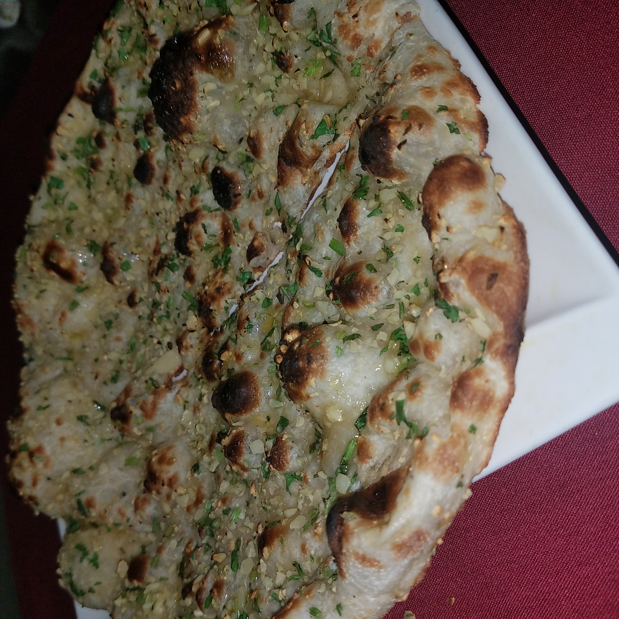 Order Garlic Naan food online from Ruchi Bangladeshi Cuisine store, Atlanta on bringmethat.com