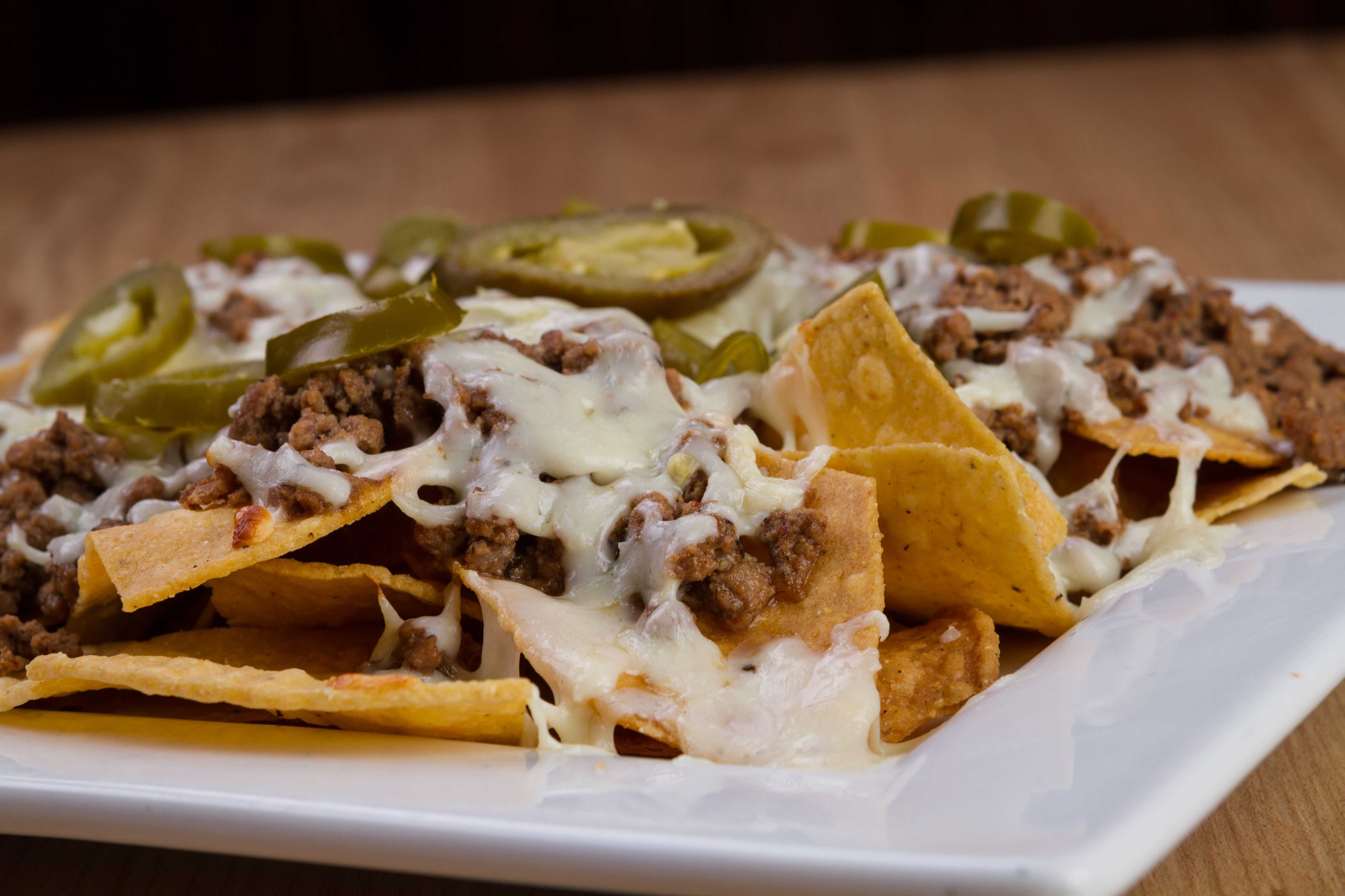 Order Nachos food online from Taqueria Mexico store, Hoover on bringmethat.com