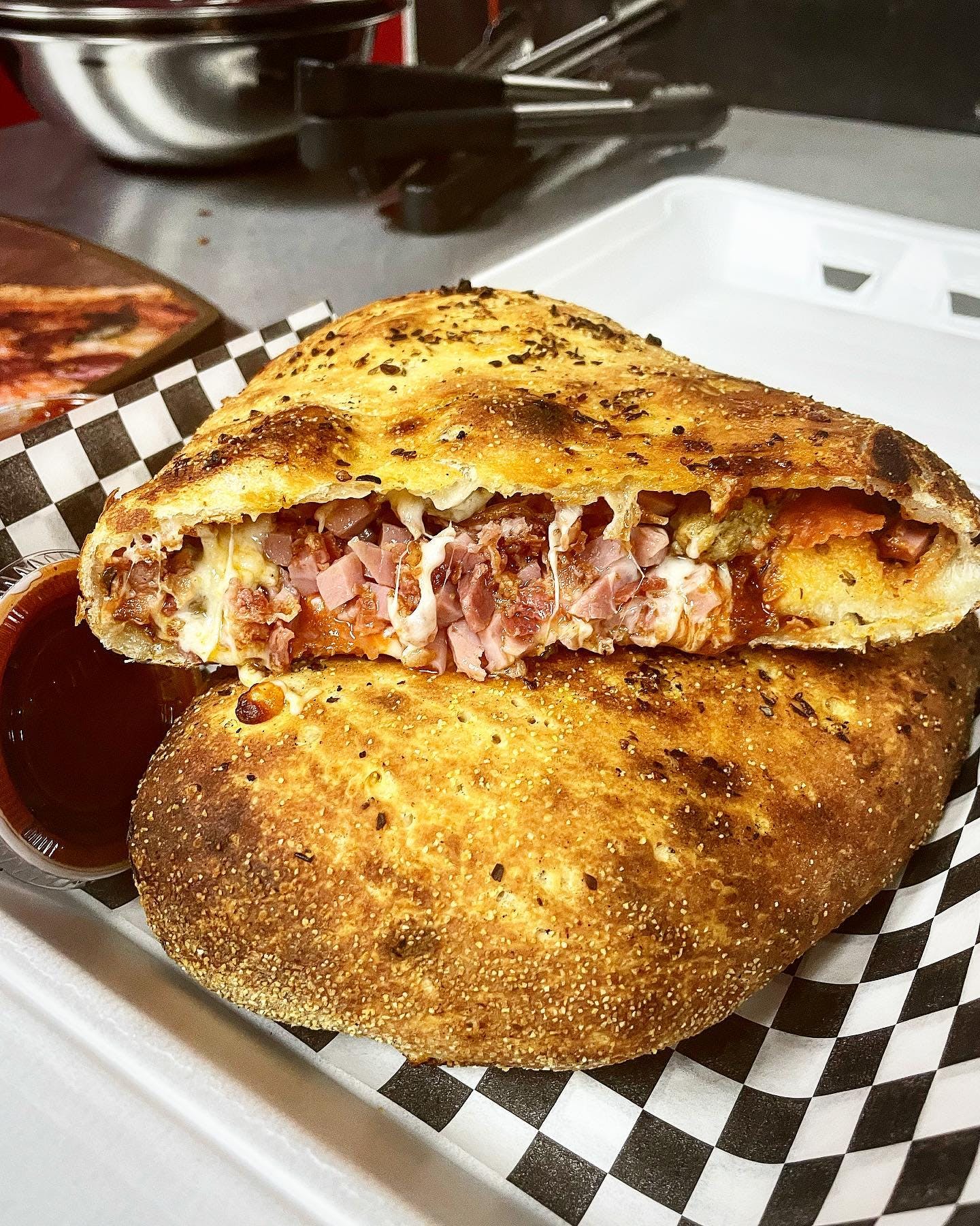 Order Meat Lover Calzone - Giant food online from Alpine Pizza store, Boise on bringmethat.com