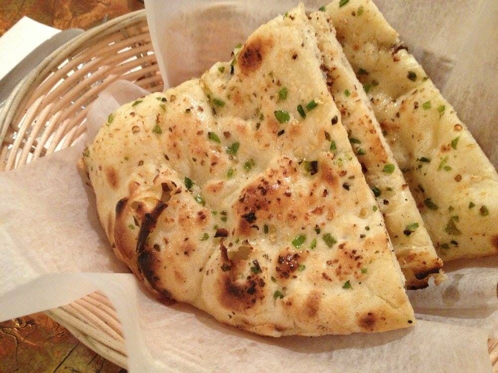 Order Garlic Naan - Bread food online from Bombay Grill store, Seattle on bringmethat.com