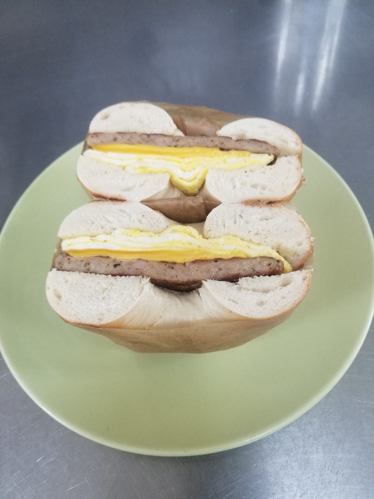 Order Sausage Eggs and Cheese on English Muffin food online from Aminas Cafe store, Bronx on bringmethat.com