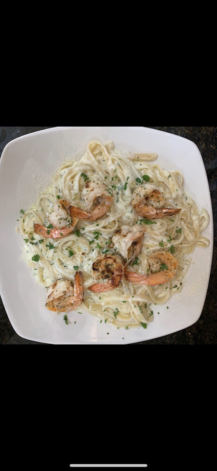 Order Grilled Shrimp Alfredo Over Fettuccine - Dinner food online from Gaby's Pizza & Grill store, Saddle Brook on bringmethat.com