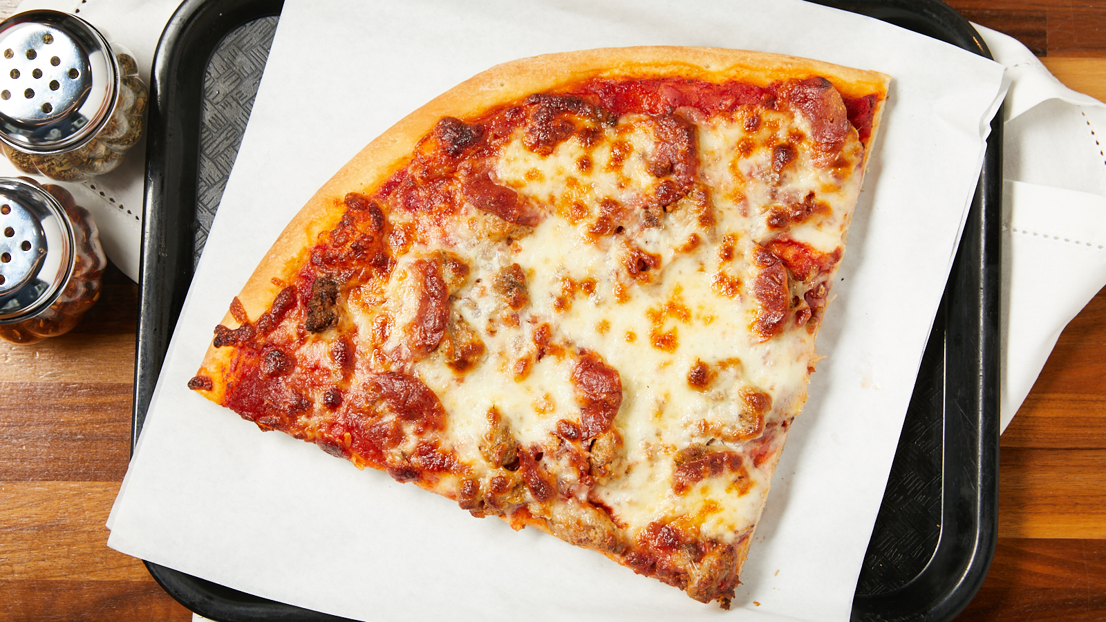 Order Meaty Pizza Slice food online from Nonna's Pizza store, Oak Lawn on bringmethat.com