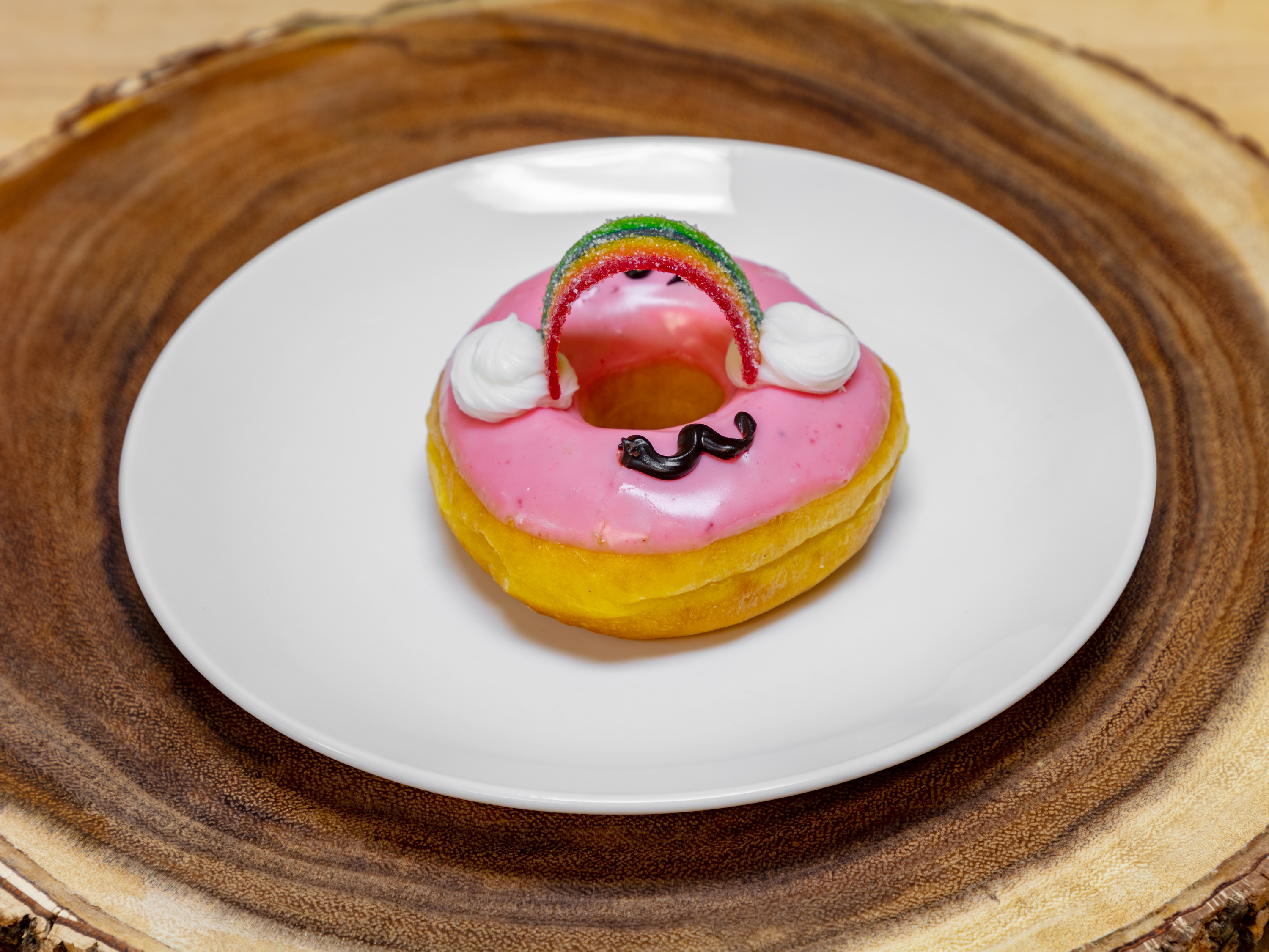 Order Rainbow Donut food online from Watters Donuts store, Allen on bringmethat.com