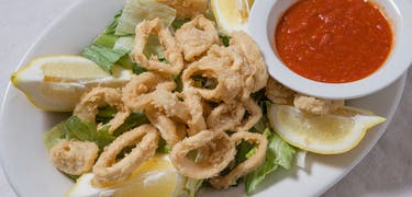 Order Home Fried Calamari - Appetizer food online from Carlo's Italian Restaurant store, Reading on bringmethat.com