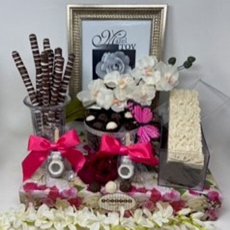 Order Pretty in pink floral log & truffle pop gift centerpiece food online from Twisted Gourmet Chocolates store, Passaic on bringmethat.com