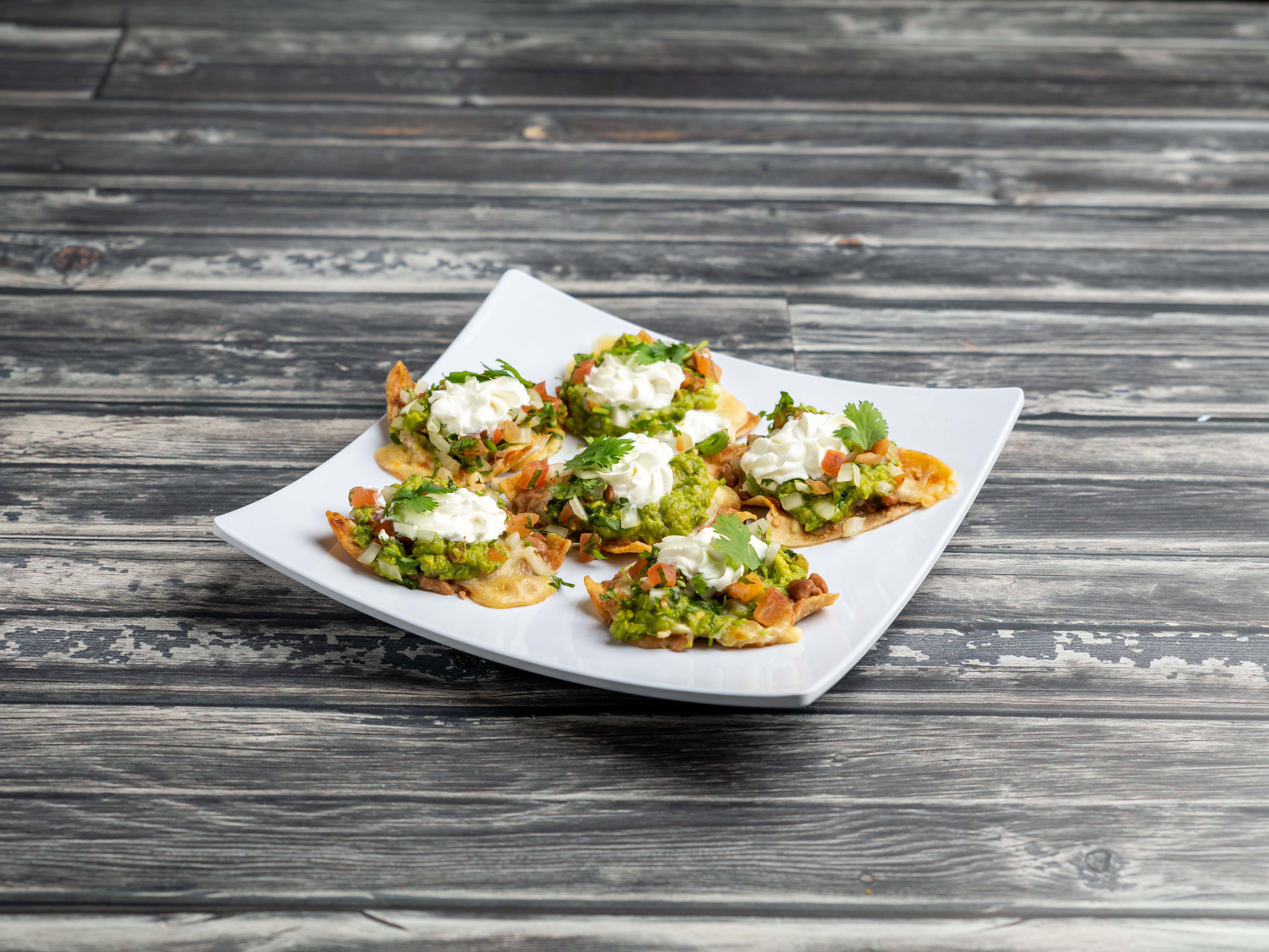 Order Nachos food online from O'manny's Mexican Restaurant store, Chicago on bringmethat.com