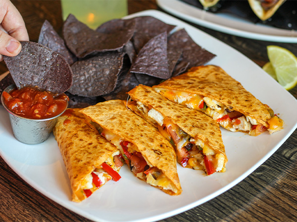 Order Loaded Chicken Quesadilla food online from Reds At Thousand Oaks store, Grand Rapids on bringmethat.com