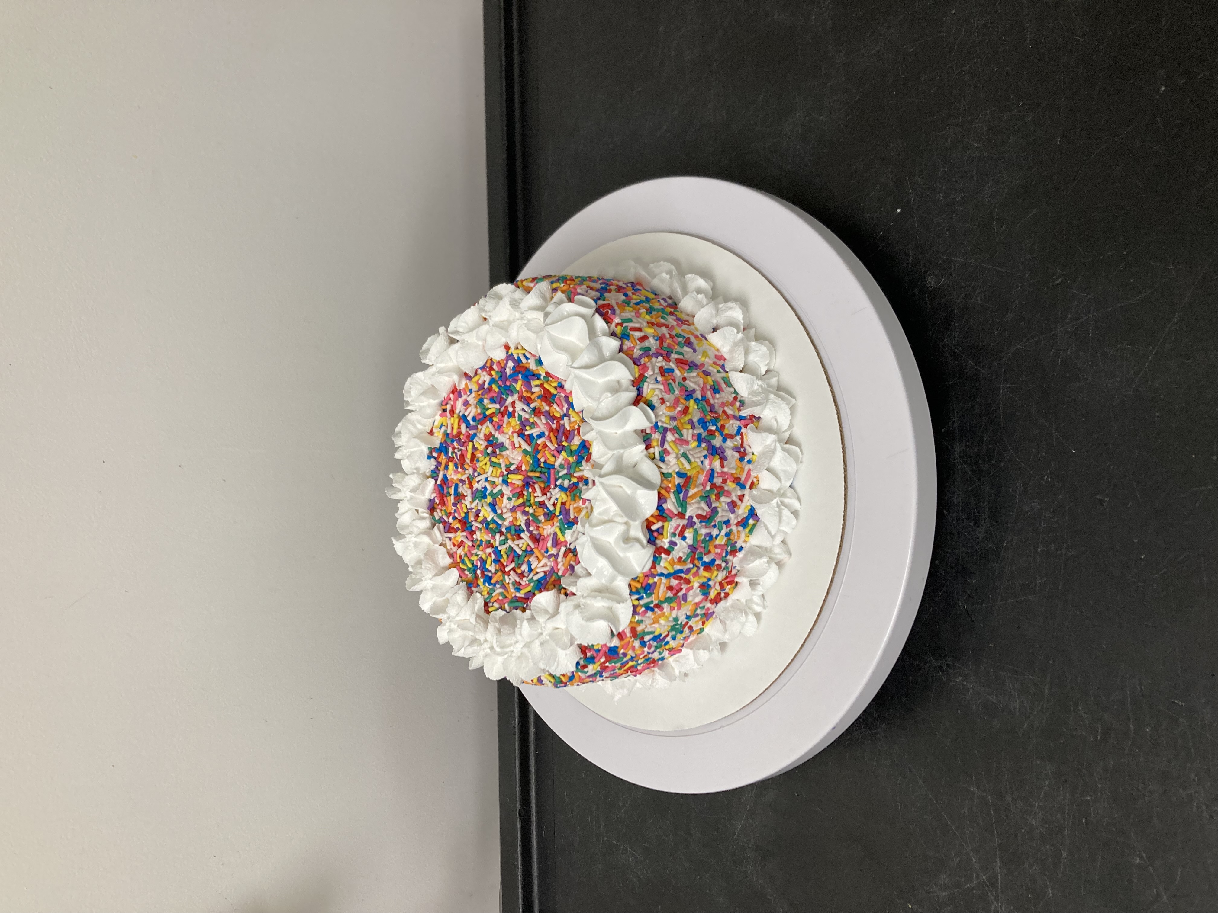Order  Rainbow Sprinkle Cake w White Icing !!! food online from Menchie Frozen Yogurt store, League City on bringmethat.com