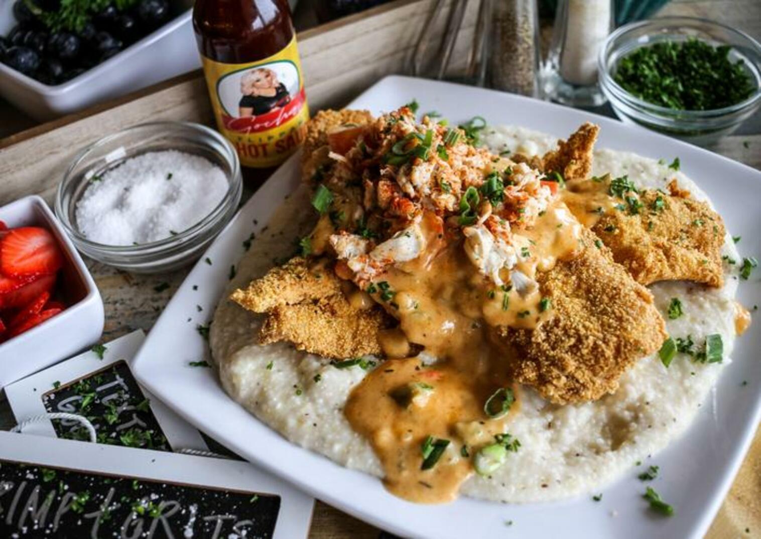 Order Cajun Creole Lump Fish and Grits food online from Gocha Breakfast Bar store, Fayetteville on bringmethat.com