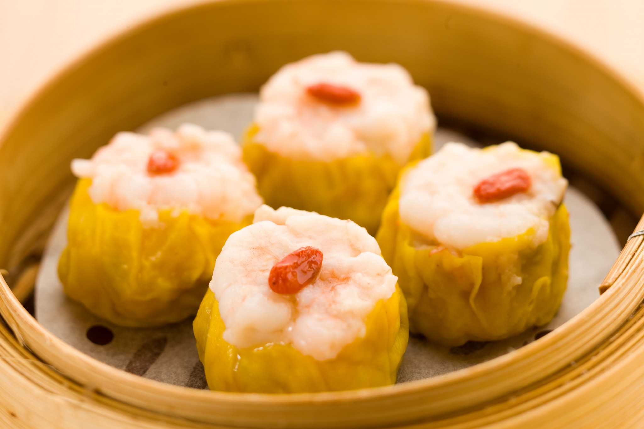 Order S7. (Siu Mai) Steamed Pork Dumplings with Shrimp food online from Timhowan store, New York on bringmethat.com