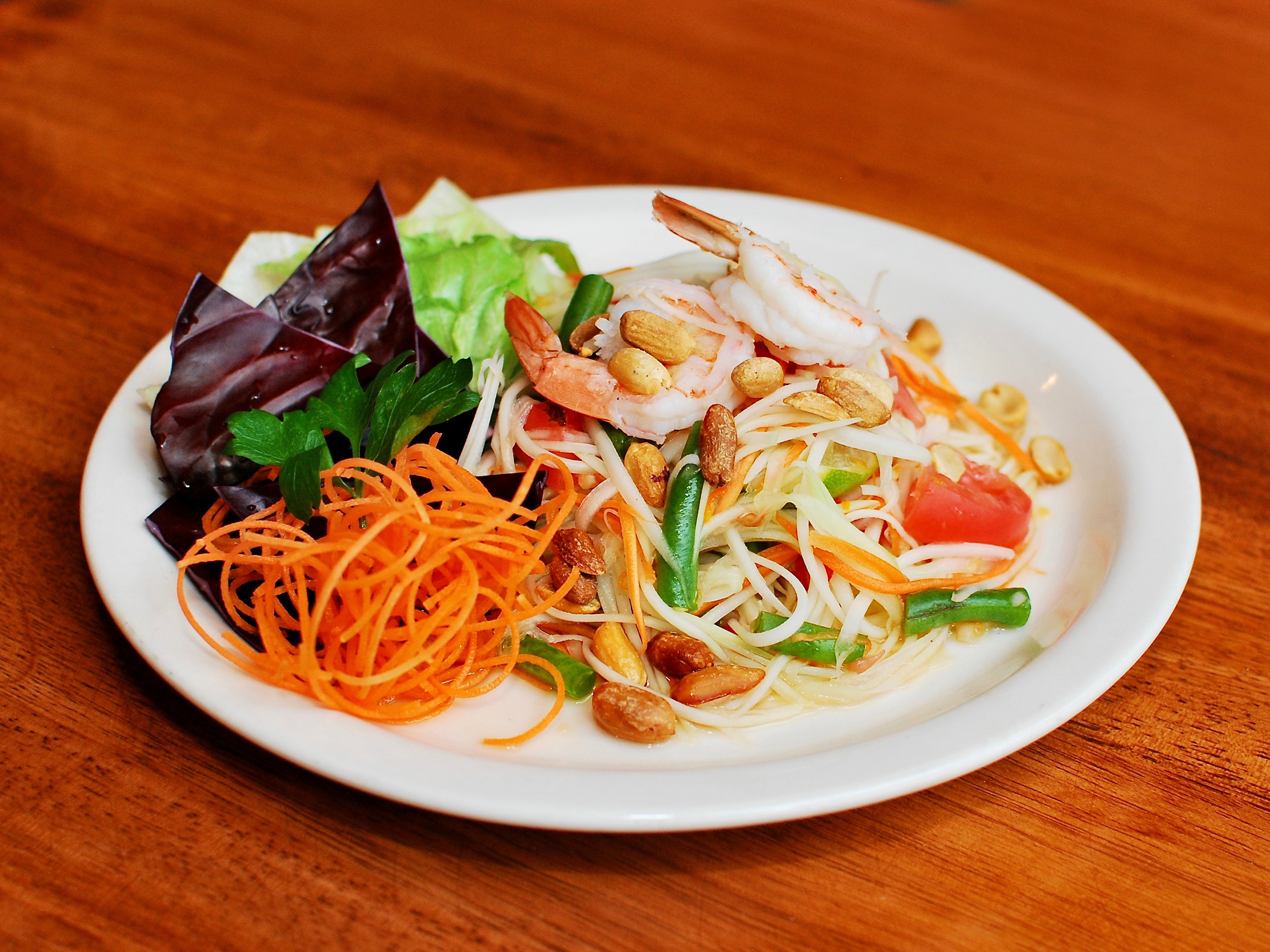 Order T302. Som Tum Salad food online from Thai Aroma store, Chicago on bringmethat.com