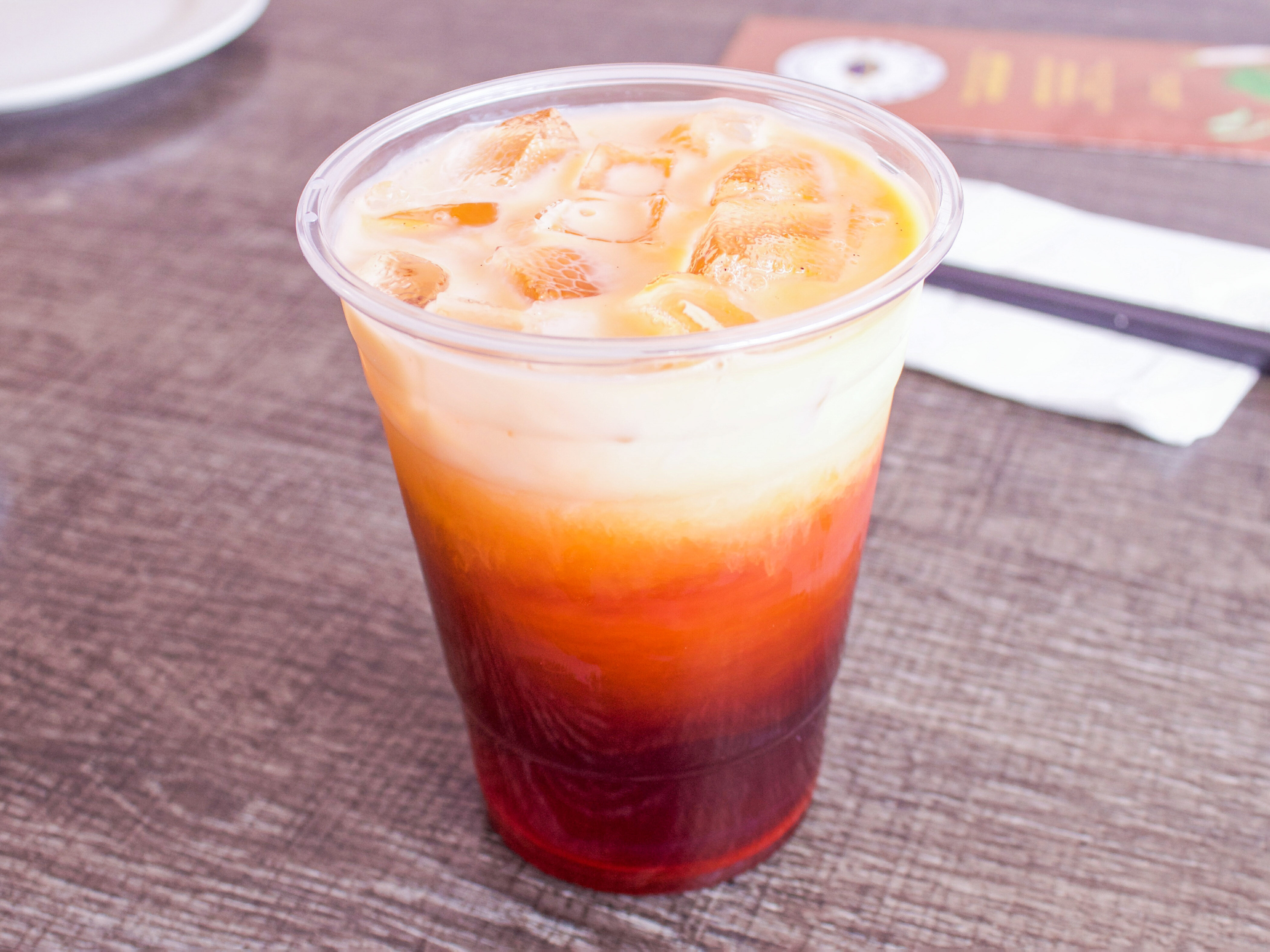Order Thai Iced Tea food online from Dumpling Park store, San Francisco on bringmethat.com