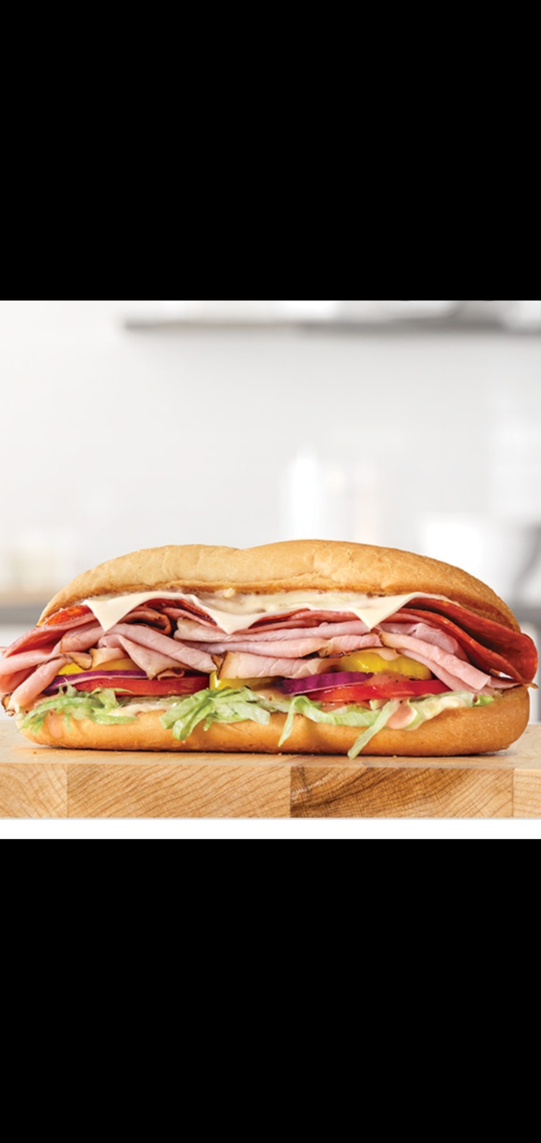 Order Turkey Ham & Beef Salami Provolone Cheese Lettuce Tomatoes Banana Peppers & Red Onions Sandwich  food online from American Gourmet Foods Deli store, New York on bringmethat.com