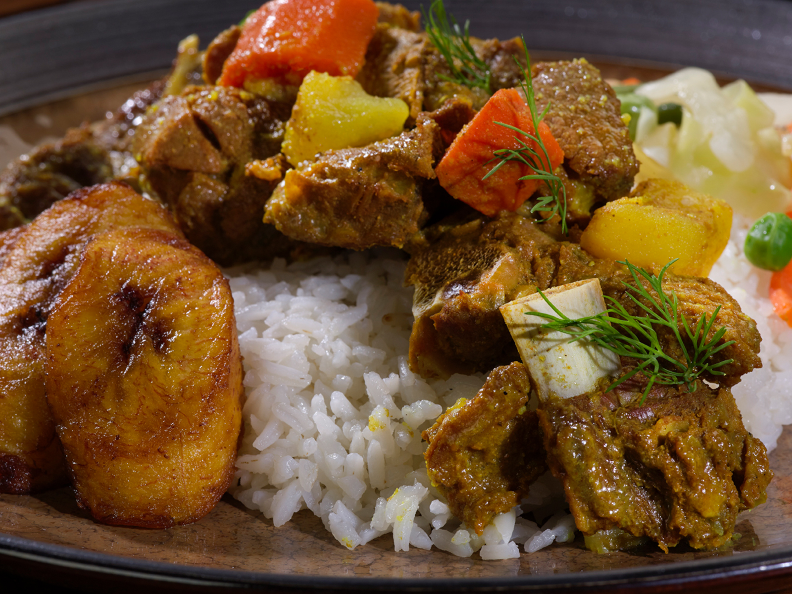 Order Curried Goat Meal food online from Golden Krust Caribbean Restaurant store, New York on bringmethat.com