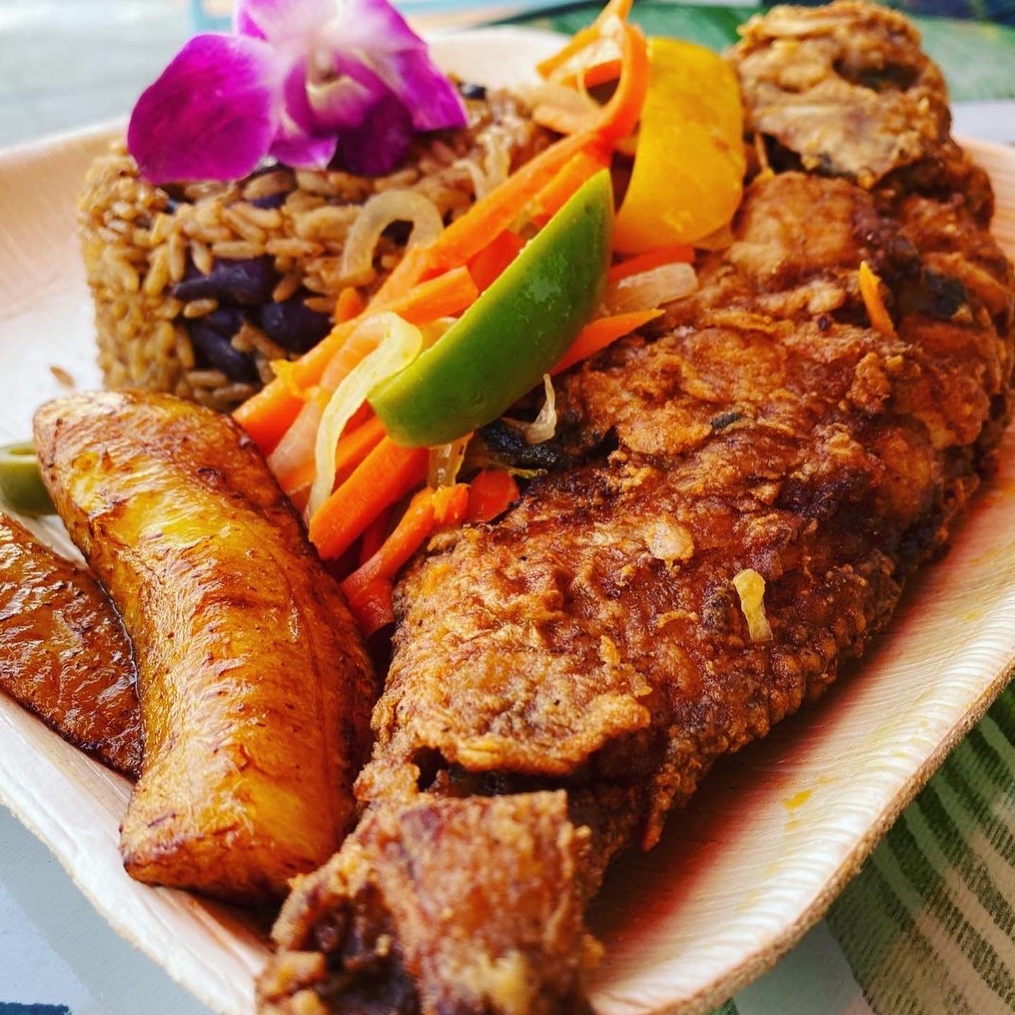 Order Chef Ann's Special Whole Fried Tilapia with Creole Rice food online from Cocobreeze store, Oakland on bringmethat.com