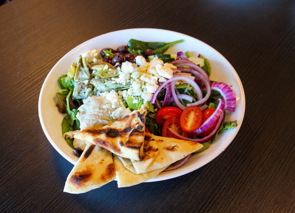 Order Greek Salad food online from Junior's Bar and Grill store, Albany on bringmethat.com