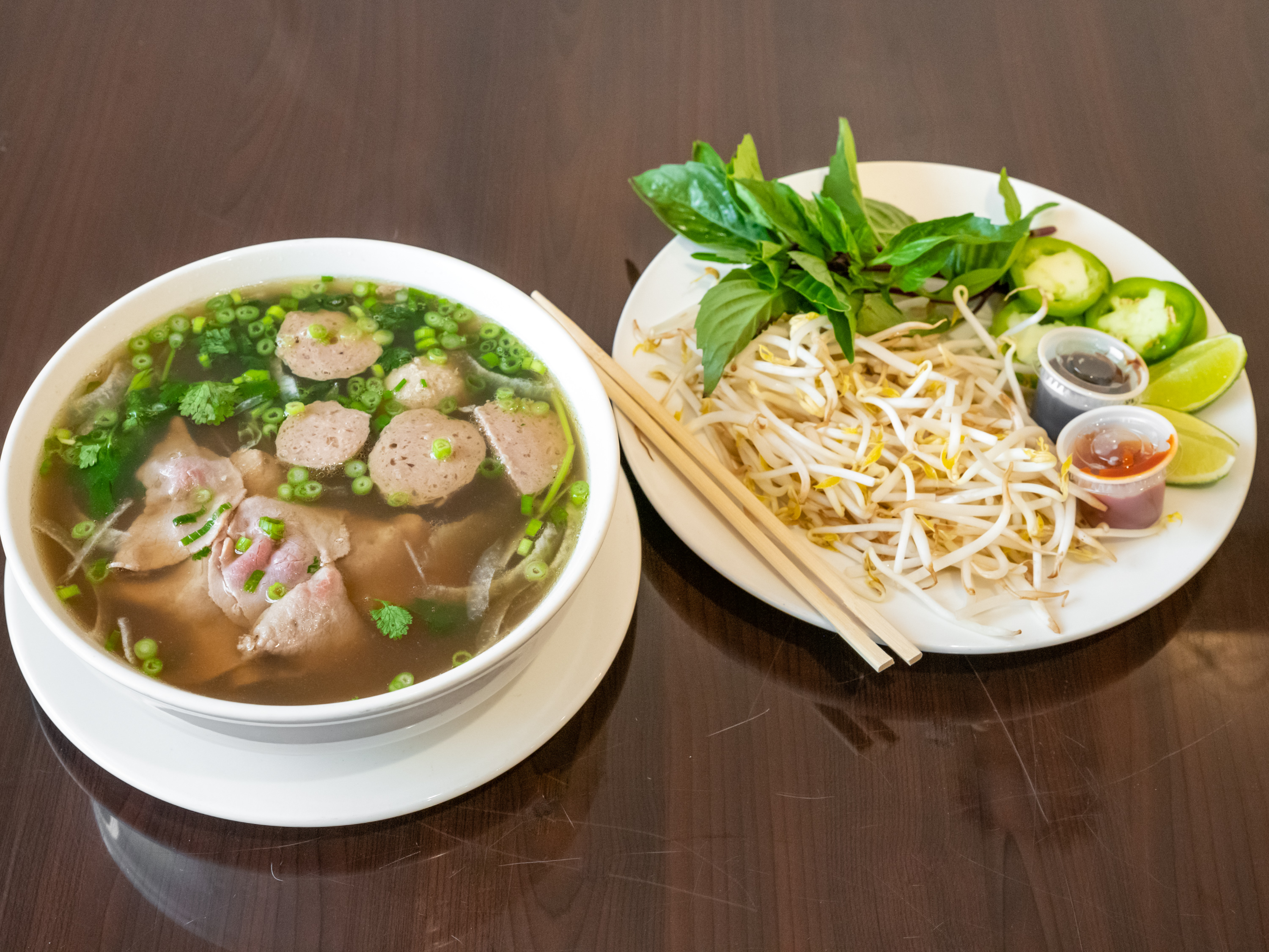 Order Pho Tai Bo Vien (Rare steak and Meatballs) food online from Banh Mi Viet store, Fort Worth on bringmethat.com