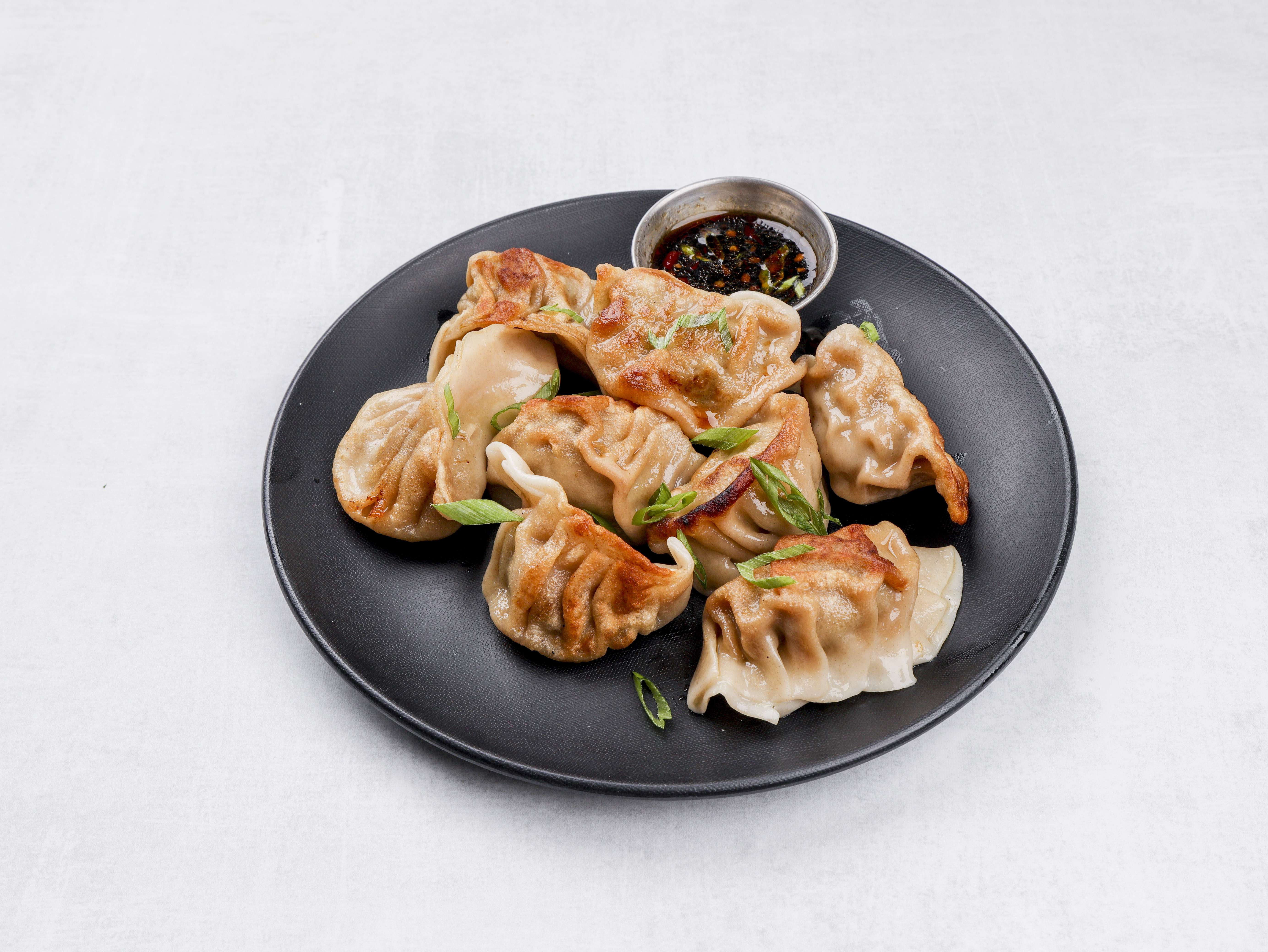 Order 10. Fried Dumplings food online from Loon Sheng store, Columbia on bringmethat.com
