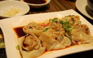 Order 12 Piece Szechuan Spicy Dumplings food online from Cafe Panda Garden store, Houston on bringmethat.com