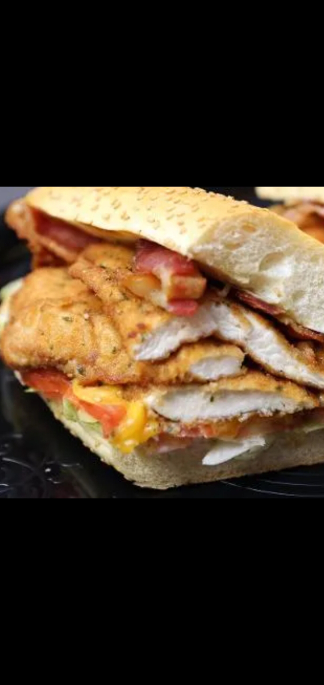 Order Spicy Chicken Cutlet  Bacon Cheese Tomatoes Ranch Dressing food online from American Gourmet Foods Deli store, New York on bringmethat.com