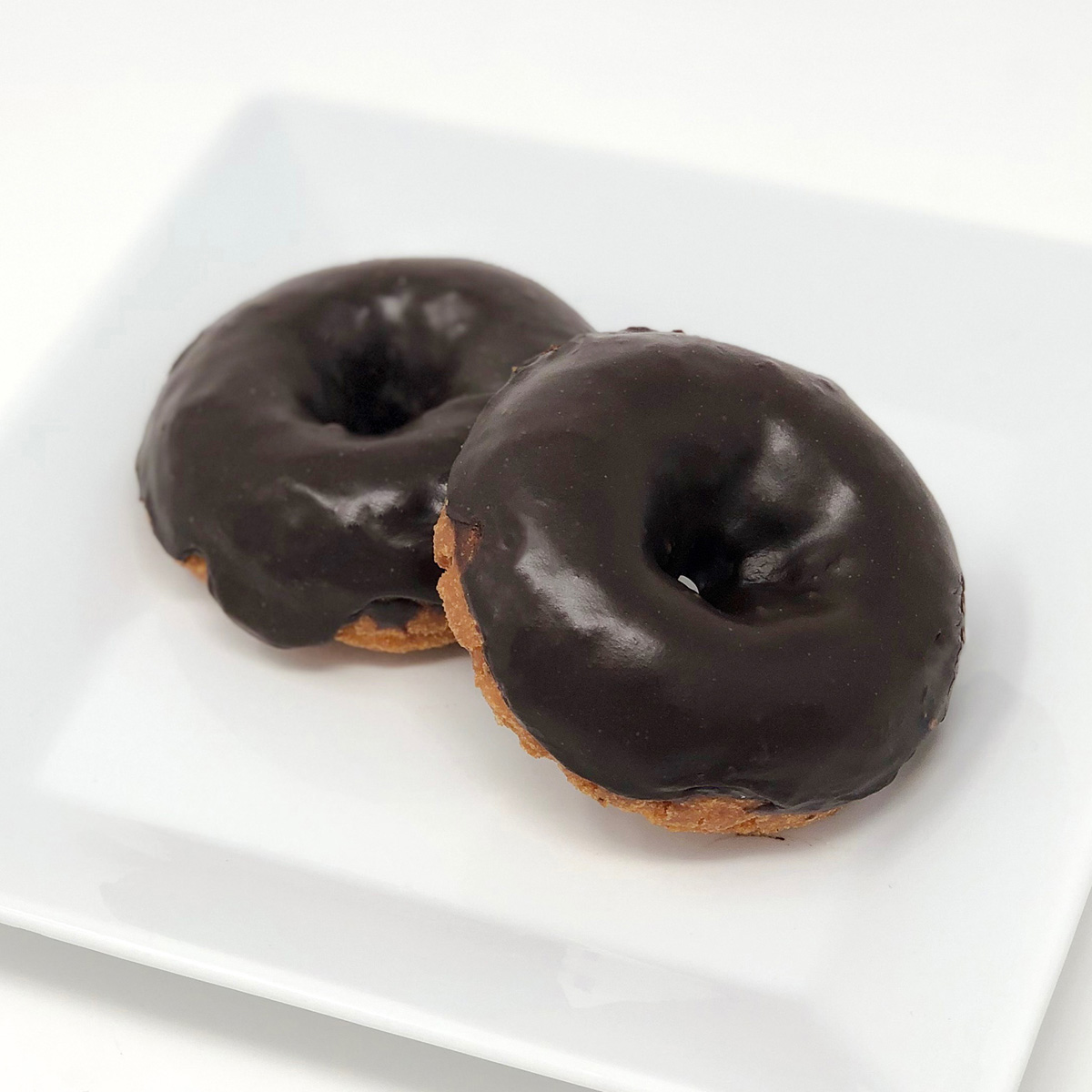 Order Vanilla Cake Donut with Chocolate Icing food online from Merritt Bakery store, Tulsa on bringmethat.com