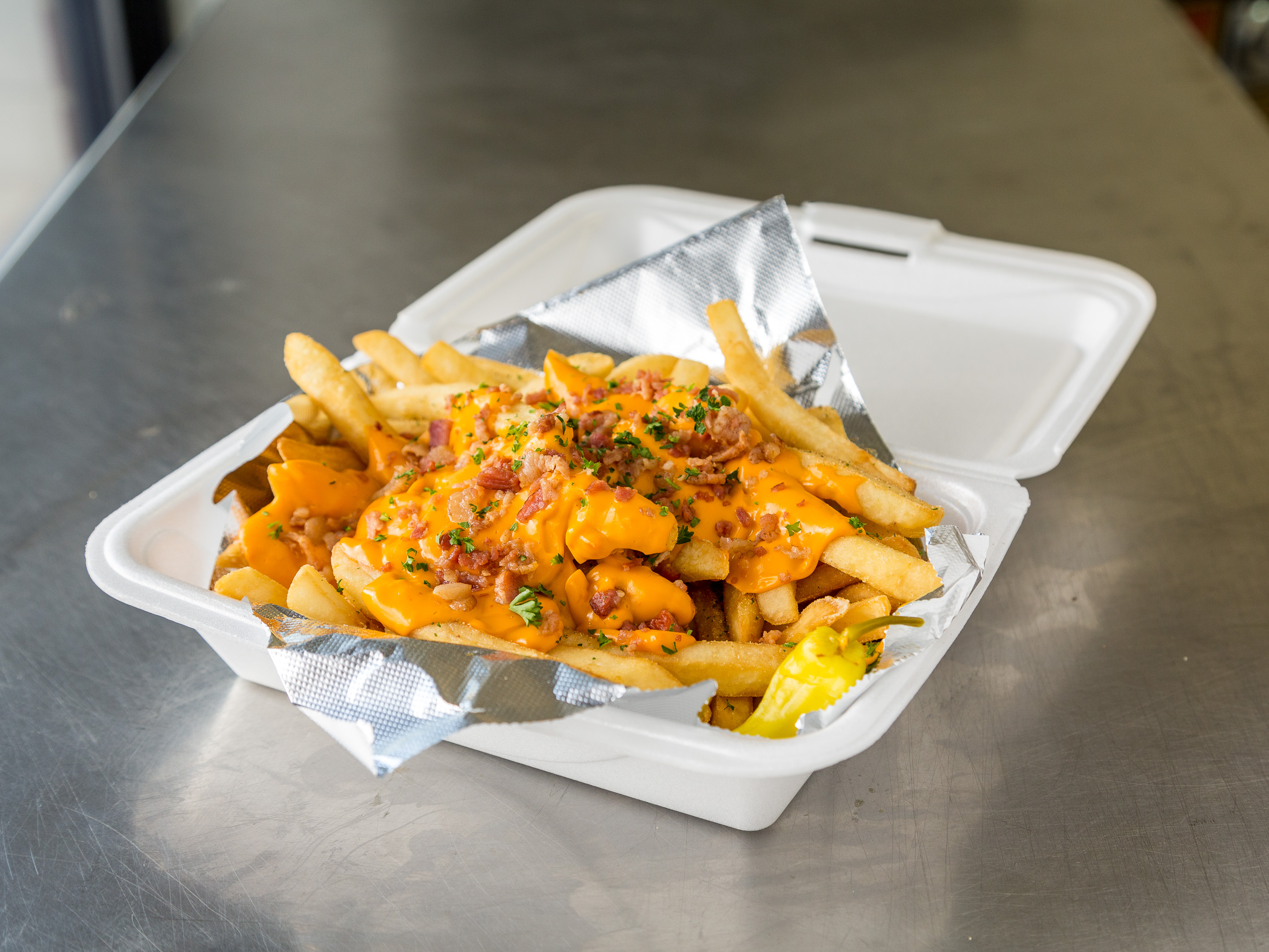 Order Cheese and Bacon Loaded Fries food online from Revolution Pizza store, Willowick on bringmethat.com