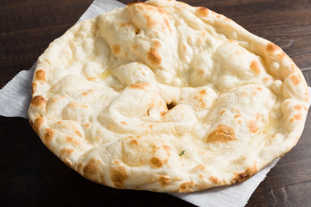 Order Butter Naan food online from Royal Indian Cuisine store, San Francisco on bringmethat.com