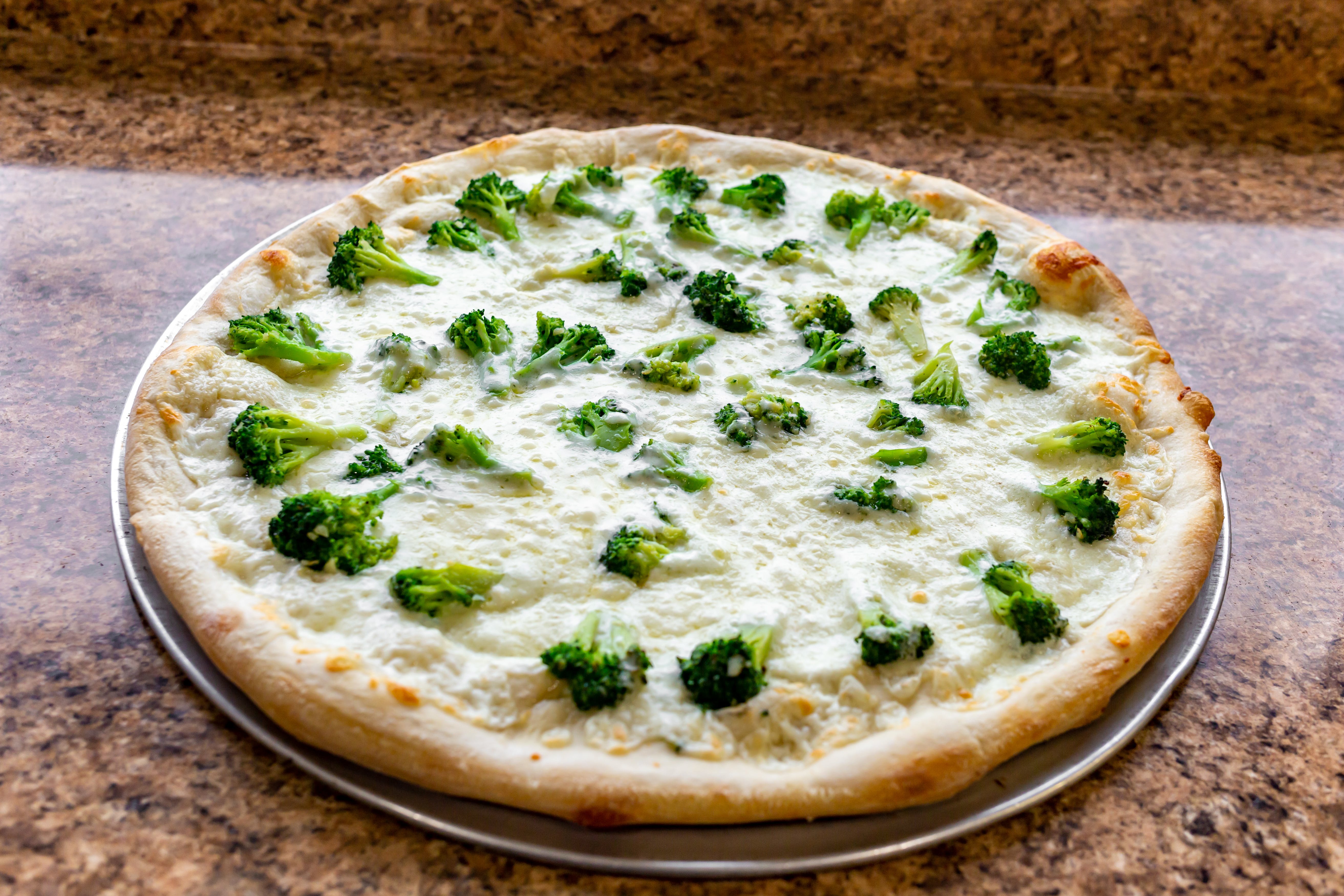 Order Broccoli Pizza - Large food online from Lorenzo's Pizza store, St James on bringmethat.com