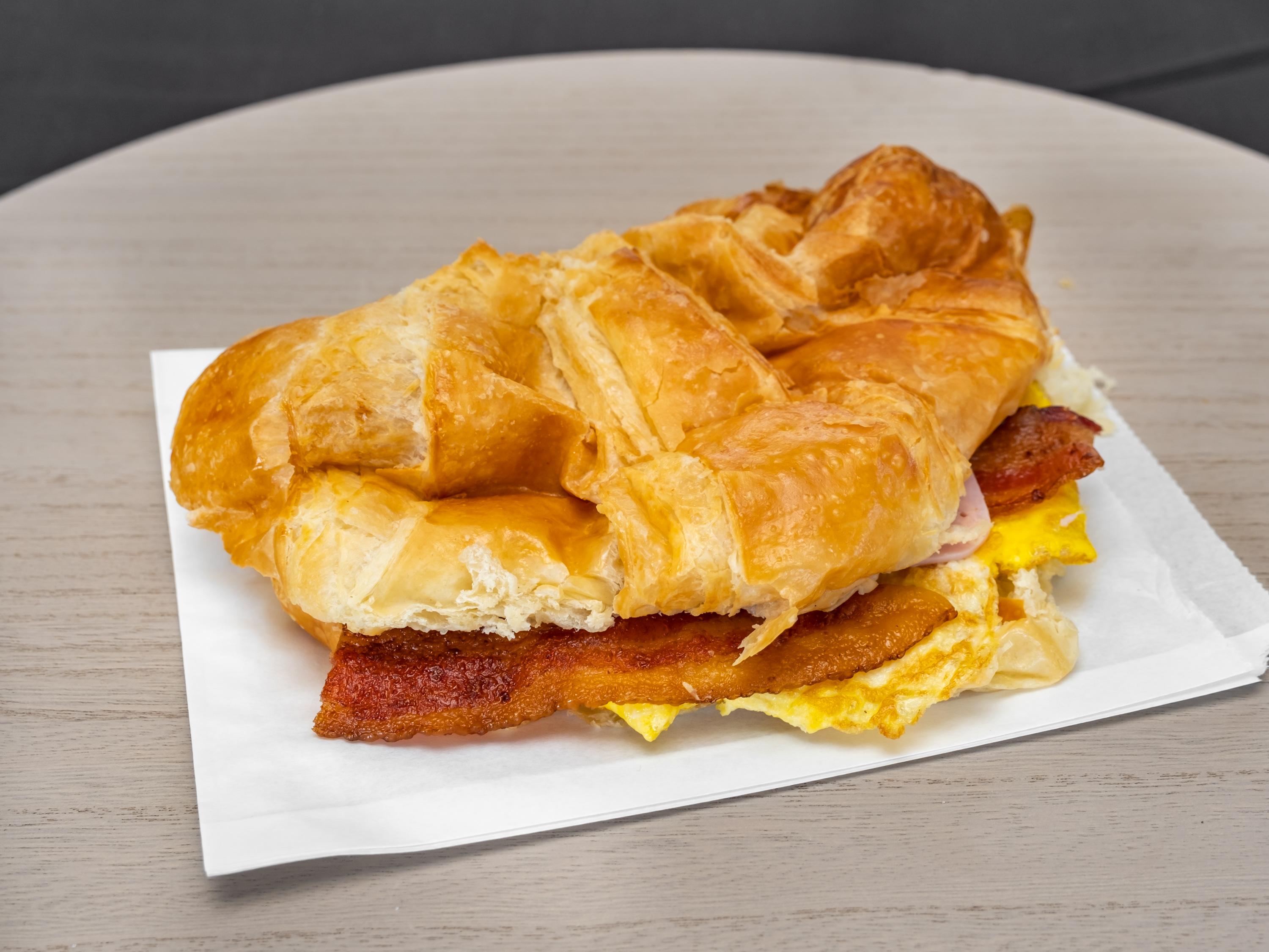 Order Ham Bacon Egg and Cheese Croissant food online from Banning Donuts store, Banning on bringmethat.com