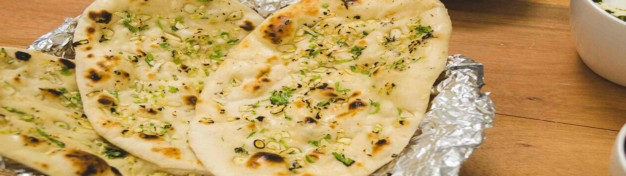 Order Butter Naan food online from Curries store, Everett on bringmethat.com