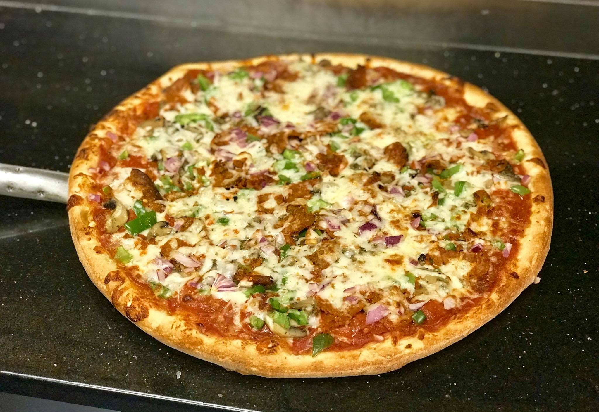 Order Deluxe Pizza - Small 10" (4 Cut ) food online from Tani Pizza store, Butler on bringmethat.com