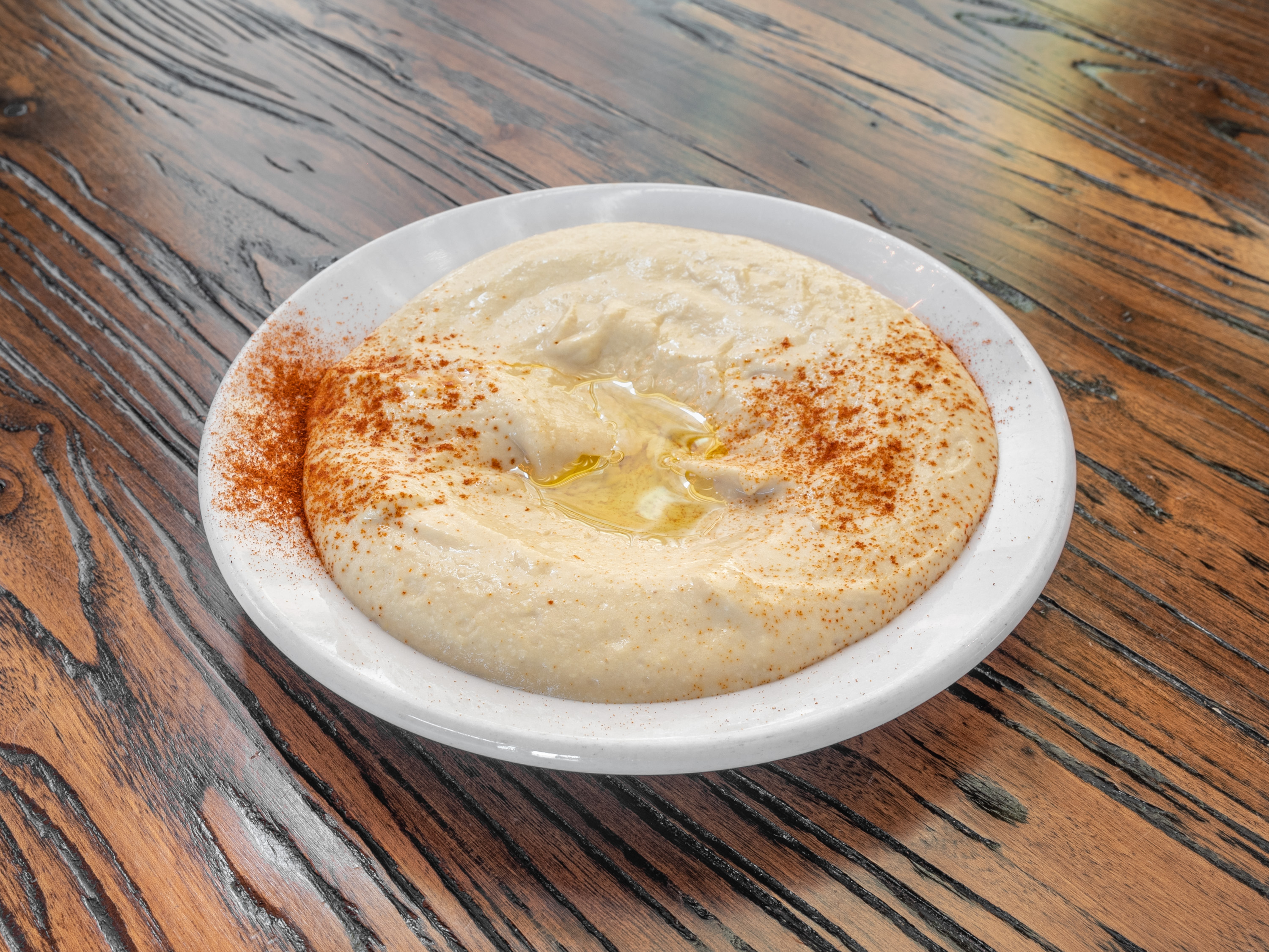 Order Hummus food online from Aladdin Mediterranean Grill store, Denver on bringmethat.com