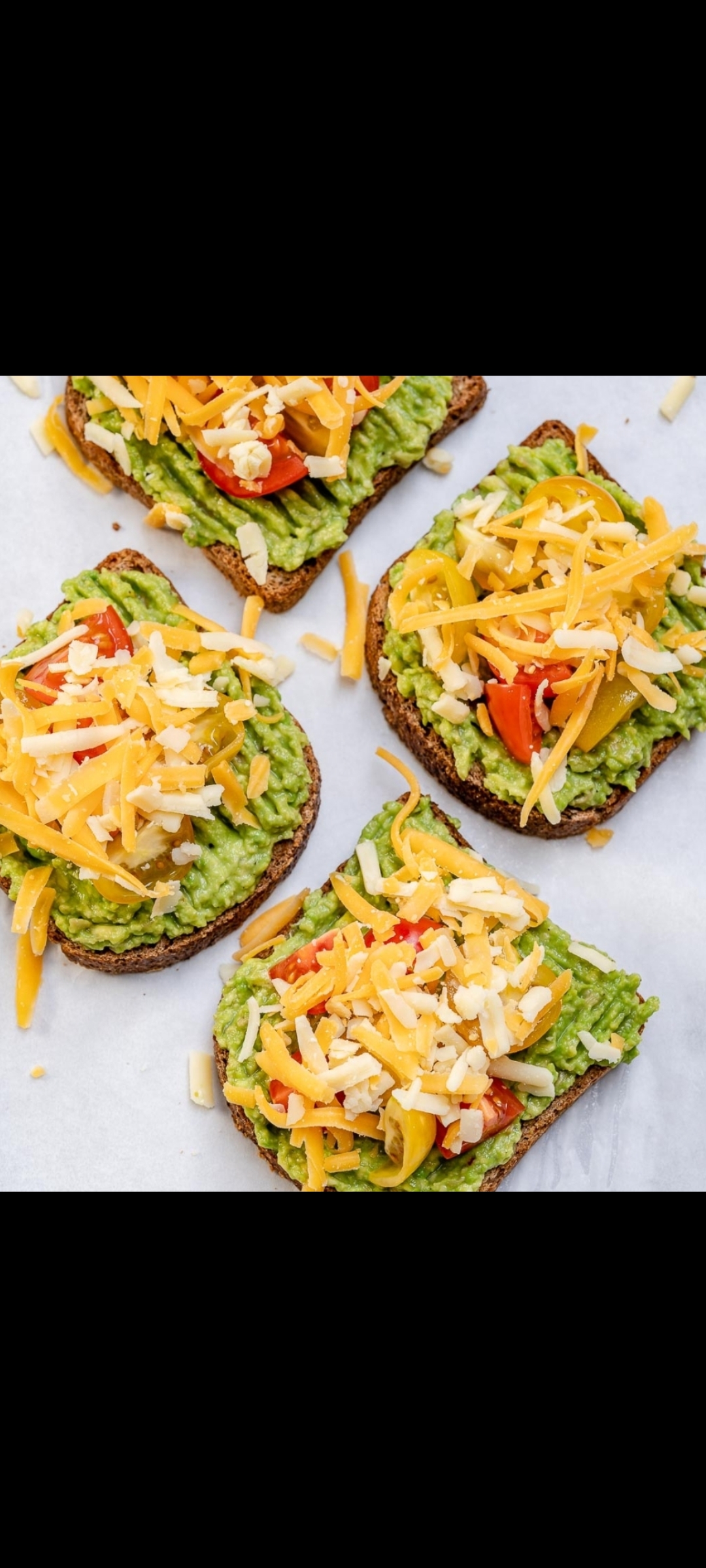 Order Cheesy Avocado Sandwich (half avocado, jalapeños, shredded Vermont  cheddar cheese, tomatoes & parmesan cheese) food online from American Gourmet Foods Deli store, New York on bringmethat.com